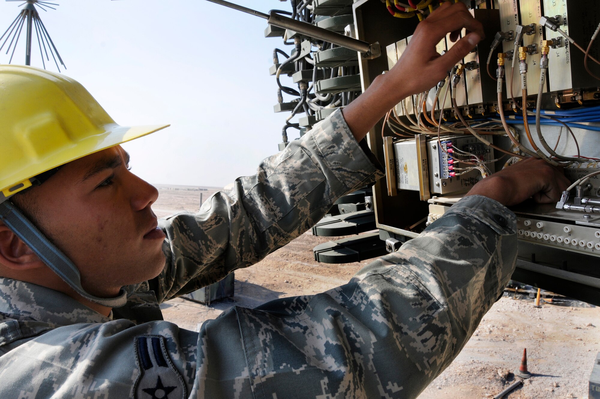 Airman 1st Class William Lundy, a radar maintenance technician assigned to the 71st Expeditionary Air Control Squadron, adjusts the receiver assembly, Dec. 30, 2008, at an undisclosed air base in Southwest Asia.  The radar maintenance team assures that the radars remain in good working condition and calibration.  The radars provide an extensive radar presence over the entire Arabian Gulf region.  They track every aircraft in the sky, with the detailed information; the 71 EACS team is able to distinguish the flight characteristics of any aircraft flying within range, which allows a determination if a plane is friendly or foe.  Airman Lundy is a native of Clarksville, Tenn.  The 71st Expeditionary Air Control Squadron is deployed from Aviano Air Base, Italy, in support of Operations Iraqi and Enduring Freedom and Joint Task Force-Horn of Africa.  (U.S. Air Force photo by Tech. Sgt. Michael Boquette/Released)