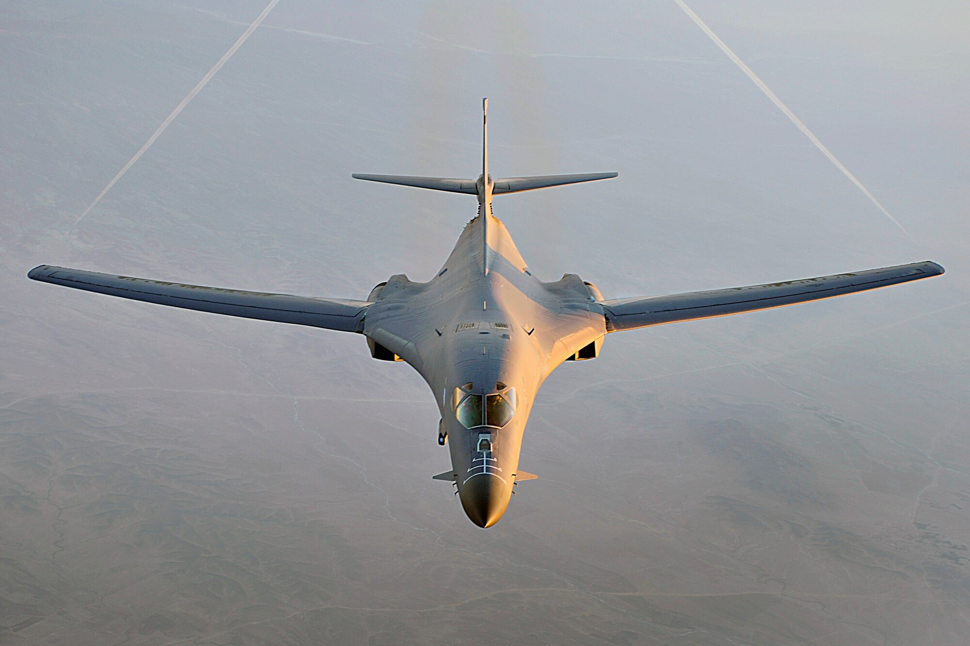 A B-1B Lancer flies a combat patrol over Afghanistan in support of Operation Enduring Freedom. The B-1B has the capability to carry guided and unguided weapons and deliver massive quantities of precision and non-precision weapons against specific targets. (U.S. Air Force photo/Staff Sgt. Aaron Allmon) 