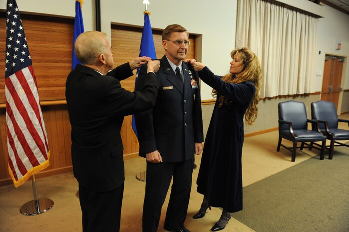 Maj. Gen. Stephen Hoog, U.S. Air Force Warfare Center commander, is pinned on by his wife, Cinde, and retired Gen. Jack Gregory at Nellis Air Force Base, Nev., Dec. 22, 2008. (U.S. Air Force photo/Senior Airman Brian Ybarbo)