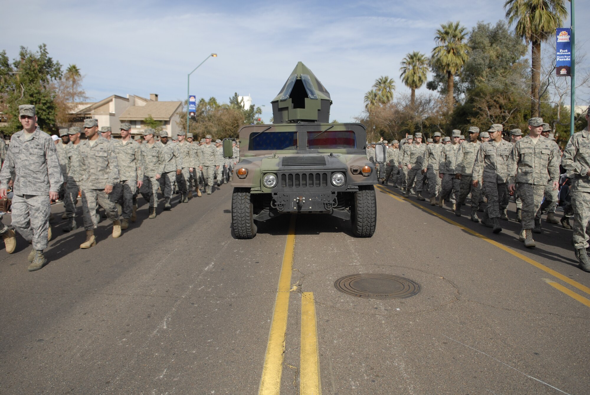 A formation of Airmen walks through downtown Phoenix during the 38th Annual Fiesta Bowl Parade Jan. 3. More than 100 Airmen participated in the event which is part of Phoenix's Fiesta Bowl event schedule including the Insight Bowl game in Tempe, for which Luke F-16s performed a fly-over and the Fiesta Bowl game itself in which Luke Airmen will be honored. (U.S. Air Force photo/Master Sgt. William Gomez)
