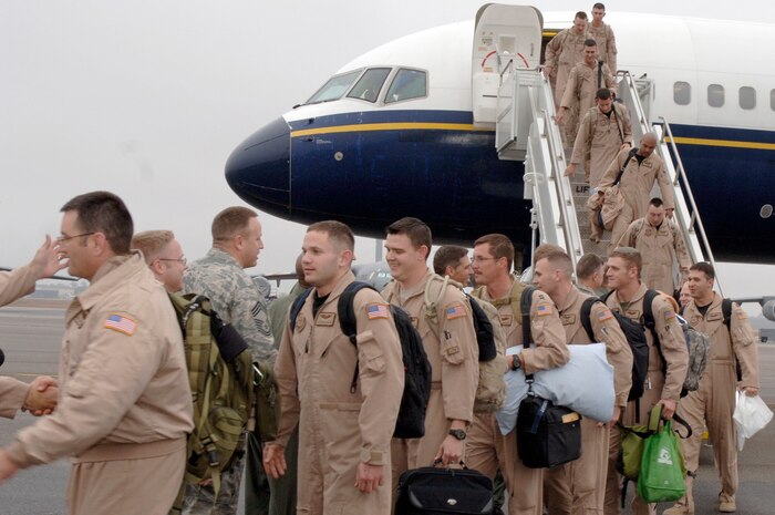 Airmen of the 15th Airlift Squadron return from their deployment on the flightline at Charleston AFB, S.C. Jan. 3. More than a 130 Airmen from the 15th Airlift Squadron returned from their 120-day deployment in Southwest Asia. (U.S. Air Force photo/Staff Sgt. Marie Cassetty)