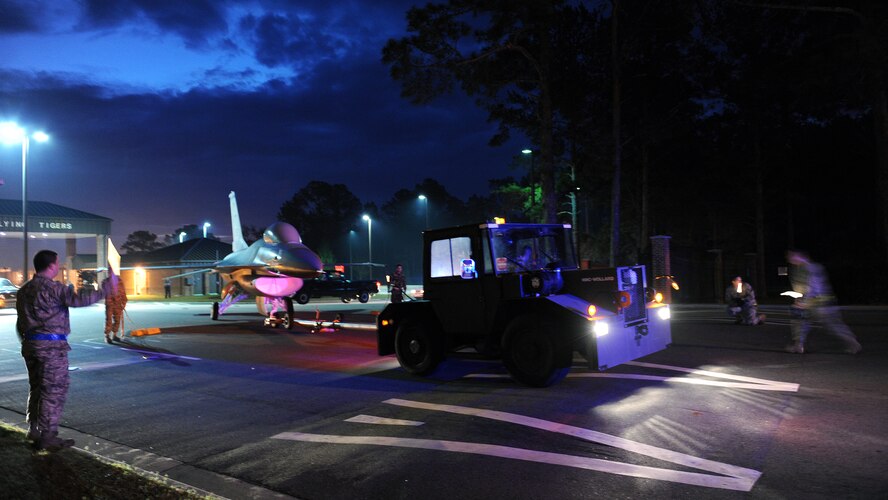 MOODY AIR FORCE BASE, Ga. -- An Airman from the 23rd Equipment Maintenance Squadron pulls an F-16C Fighting Falcon through the North Gate here Jan. 4. The 23rd EMS was assisted by the Lowndes County Sheriff’s Department and Georgia Department of Transportation to help clear the road for safe arrival to the Michael Maltz First-Term Airman and Professional Enhancement Center.  The F-16C was flown by the 74th Fighter Squadron when the squadron was stationed at Pope Air Force Base, N.C. (U.S. Air Force photo by Airman Joshua Green) 