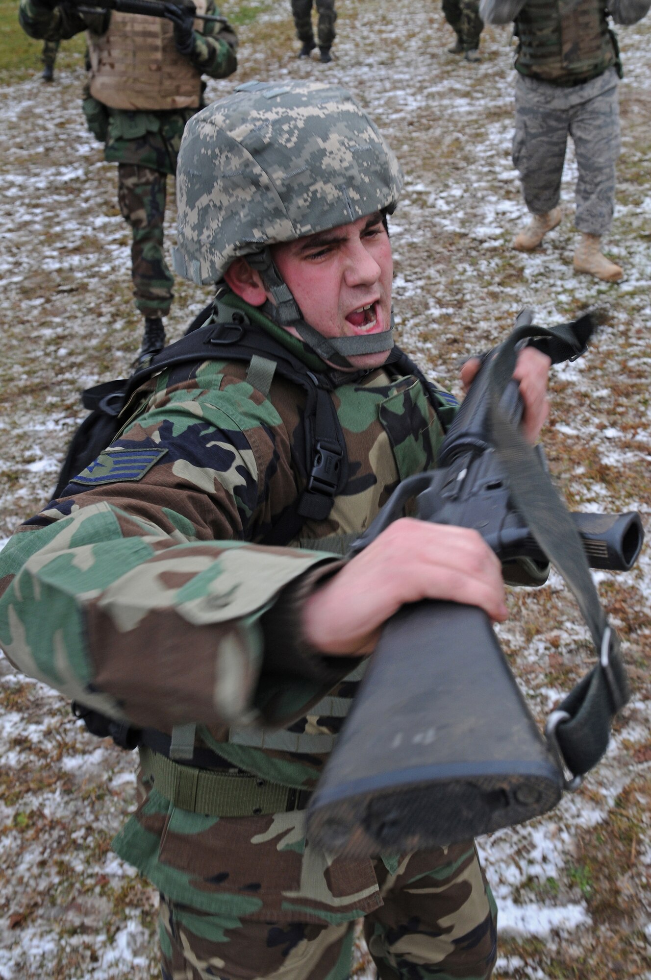 Air Force members perform rifle-defense training Dec. 18, 2008, in Einseidlerhof, Germany. Airmen participated in a two-day Combat Skills Training course in preparation for deployment. (U.S. Air Force photo by Airman 1st Class Grovert Fuentes-Contreras)