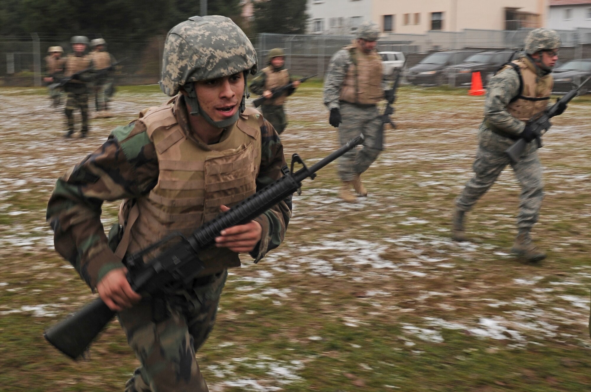 Air Force members run to their next training station Dec. 18, 2008, in Einseidlerhof, Germany. Airmen participated in a two-day Combat Skills Training course in preparation for deployment. (U.S. Air Force photo by Airman 1st Class Grovert Fuentes-Contreras)