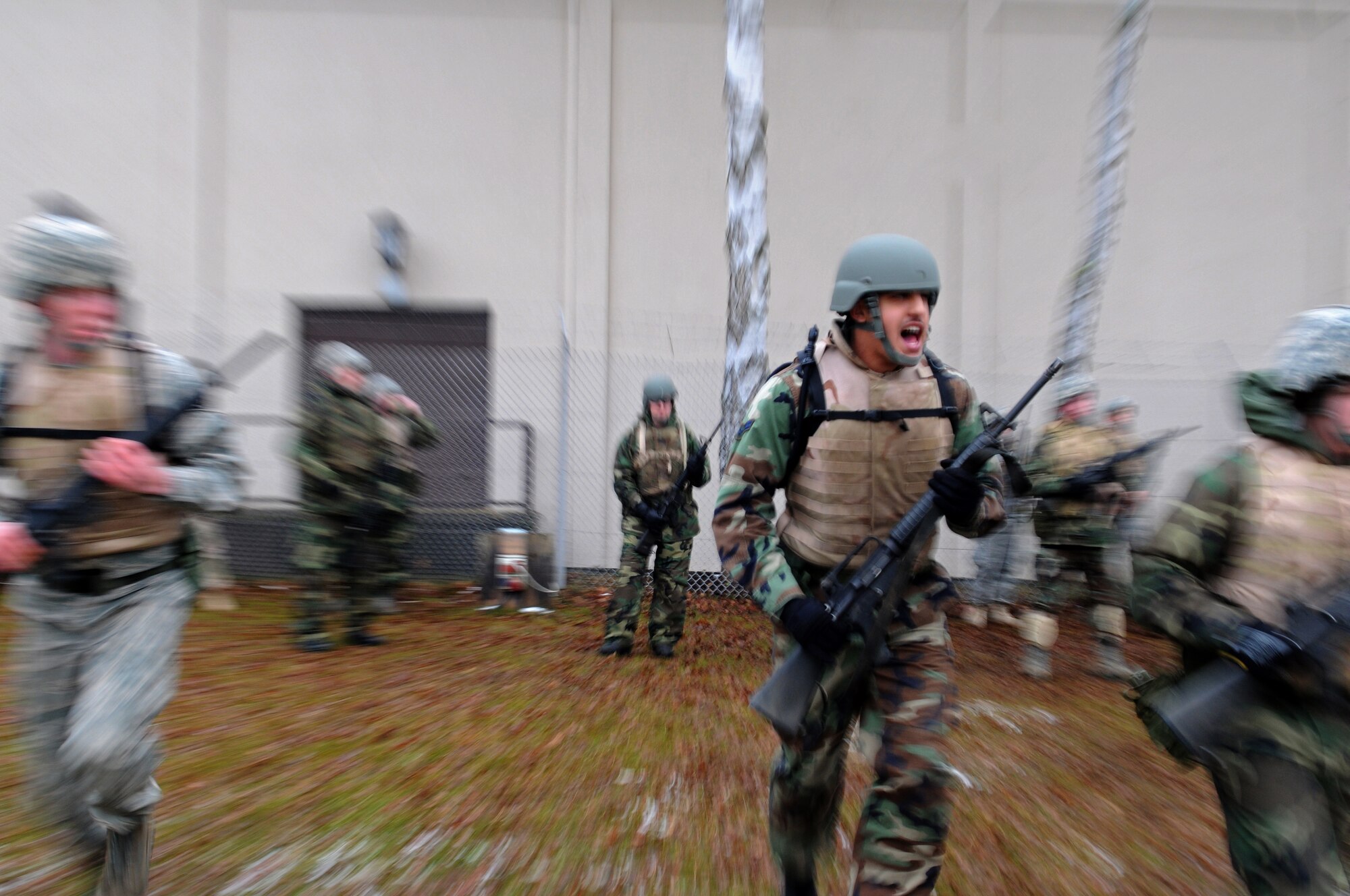 Air Force members run in column formation during Combat Skills Training Dec. 18, 2008, in Einseidlerhof, Germany. Airmen participated in the two-day course in preparation for deployment. (U.S. Air Force photo by Airman 1st Class Grovert Fuentes-Contreras)