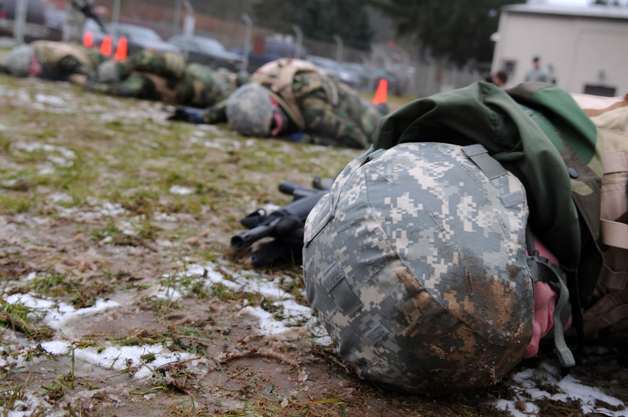 Air Force members complete the last portion of a low crawl exercise Dec. 18, 2008, in Einseidlerhof, Germany. Airmen participated in a two-day Combat Skills Training course in preparation for deployment. (U.S. Air Force photo by Airman 1st Class Grovert Fuentes-Contreras)