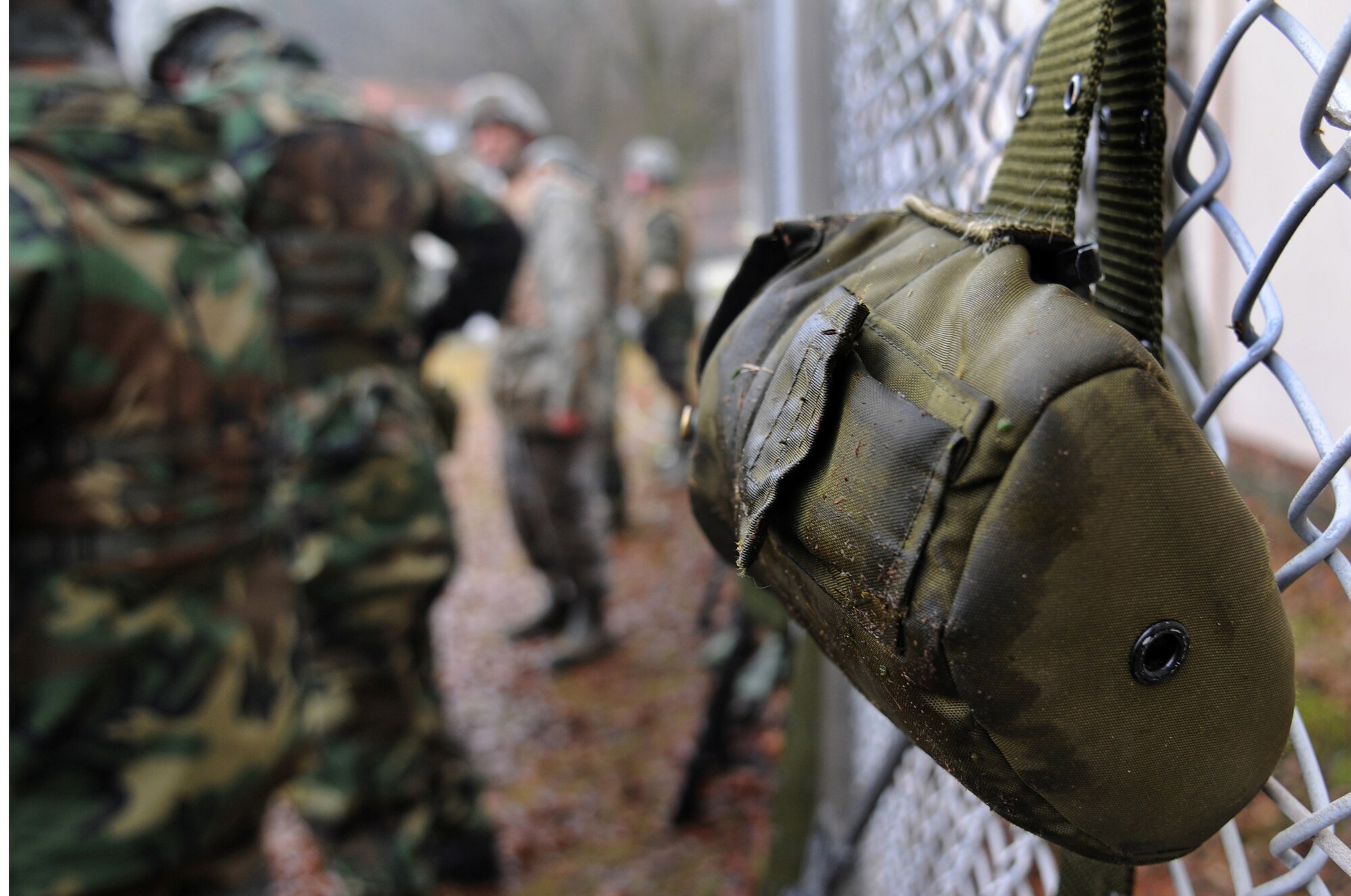 Air Force members take a hydration break after their low crawl exercise Dec. 18, 2008, in Einseidlerhof, Germany. Airmen participated in a two-day Combat Skills Training course in preparation for deployment. (U.S. Air Force photo by Airman 1st Class Grovert Fuentes-Contreras)