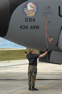 Tech. Sgt. Carl Steele, 434th Air Refueling Wing crew chief, Grissom Air Reserve Base, Ind., cinches down an emergency marker on a KC-135R Stratotanker after arrival at Andersen Air Force Base, Guam Dec. 31. The 434th Air Refueling Wing from Grissom ARW is deployed to Andersen to provide Pacific theater refueling operations and is replacing the 171st ARW Pennsylvania Air National Guard.

(U.S. Air Force photo/ Master Sgt. Kevin J. Gruenwald) released






















  












 











































  












 

























