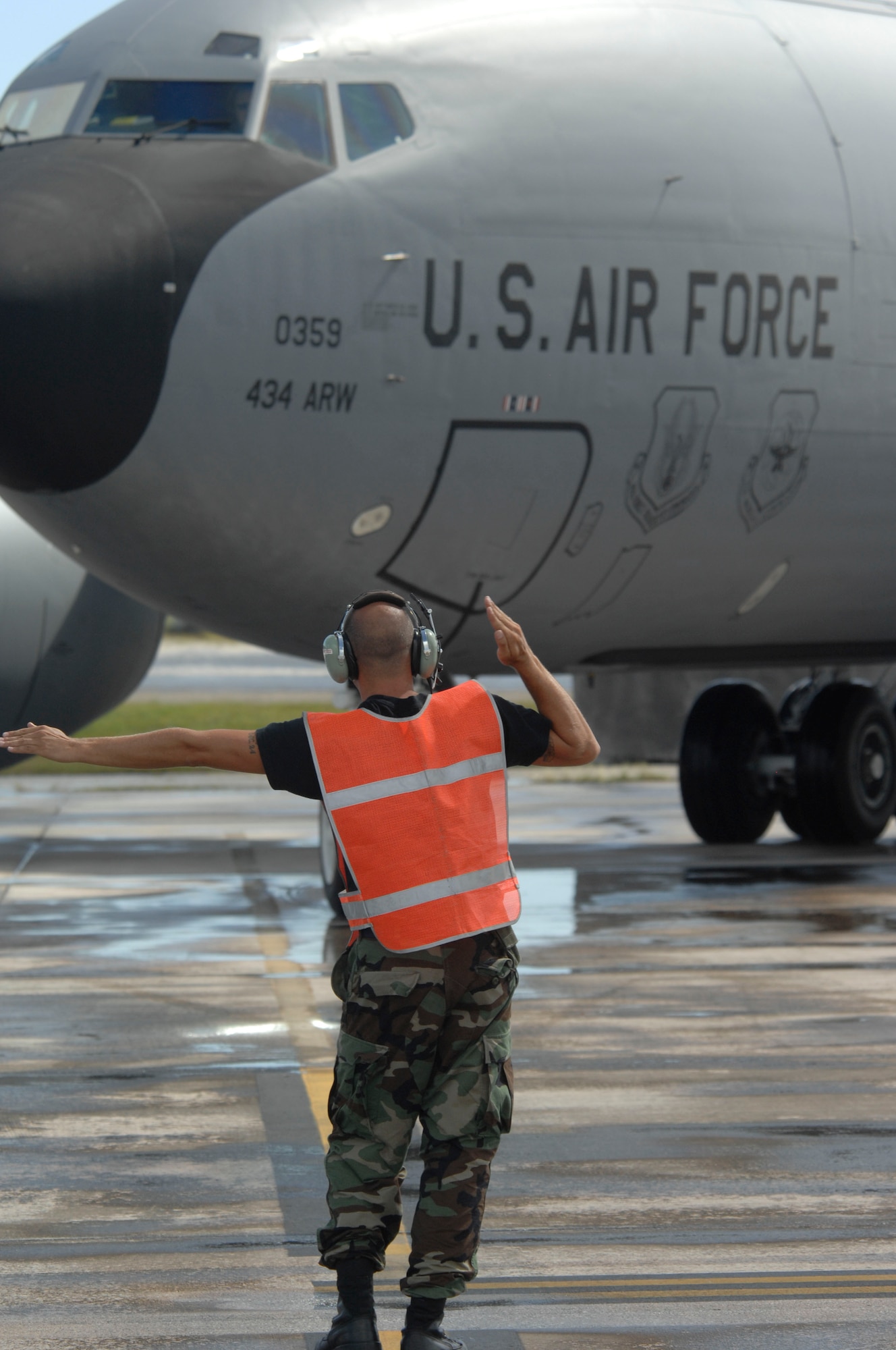 A crew chief from the 171st Air Refueling Wing Pennsylvania Air National Guard marshals in a KC-135R Stratotanker at Andersen Air Force Base, Guam Dec. 31. The 171st ARW deployment to Andersen was completed on Dec. 31 and the 434th ARW from Grissom Air Reserve Base, Ind., will now support the Pacific theater refueling operations. 

(U.S. Air Force photo/ Master Sgt. Kevin J. Gruenwald) released





















  












 











































  












 

























