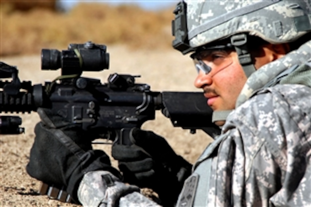 U.S. Army Spc. Edgar Ruiz checks his perimeter during a roadside clearance mission of Main Supply Route Tampa near Forward Operating Base Kalsu, Iraq, Dec. 29, 2008. Ruiz is assigned to Company C, 1st Battalion, 2nd Infantry Regiment, 172nd Infantry Brigade Combat Team.