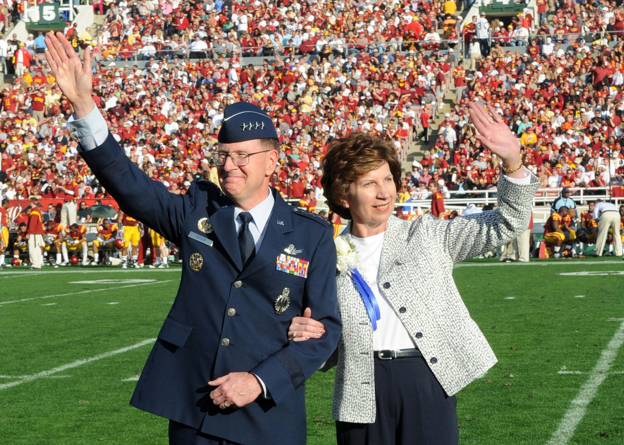 General C. Robert Kehler, Air Force Space Command commander, and his wife are acknowledged during the 95th Rose Bowl game in Pasadena, Calif., Jan. 1. The Los Angeles Air Force Base Honor Guard presented the colors during the National Anthem. General Kehler, Lt. Gen Tom Sheridan, Space and Missile Systems Center commander, Brig, Gen. Garrett Harencak, 509th Bomb Wing commander, and their spouses represented the Air Force during the 120th annual Tournament of Roses Parade and 95th Rose Bowl games. (Photo by Atiba Copeland)
