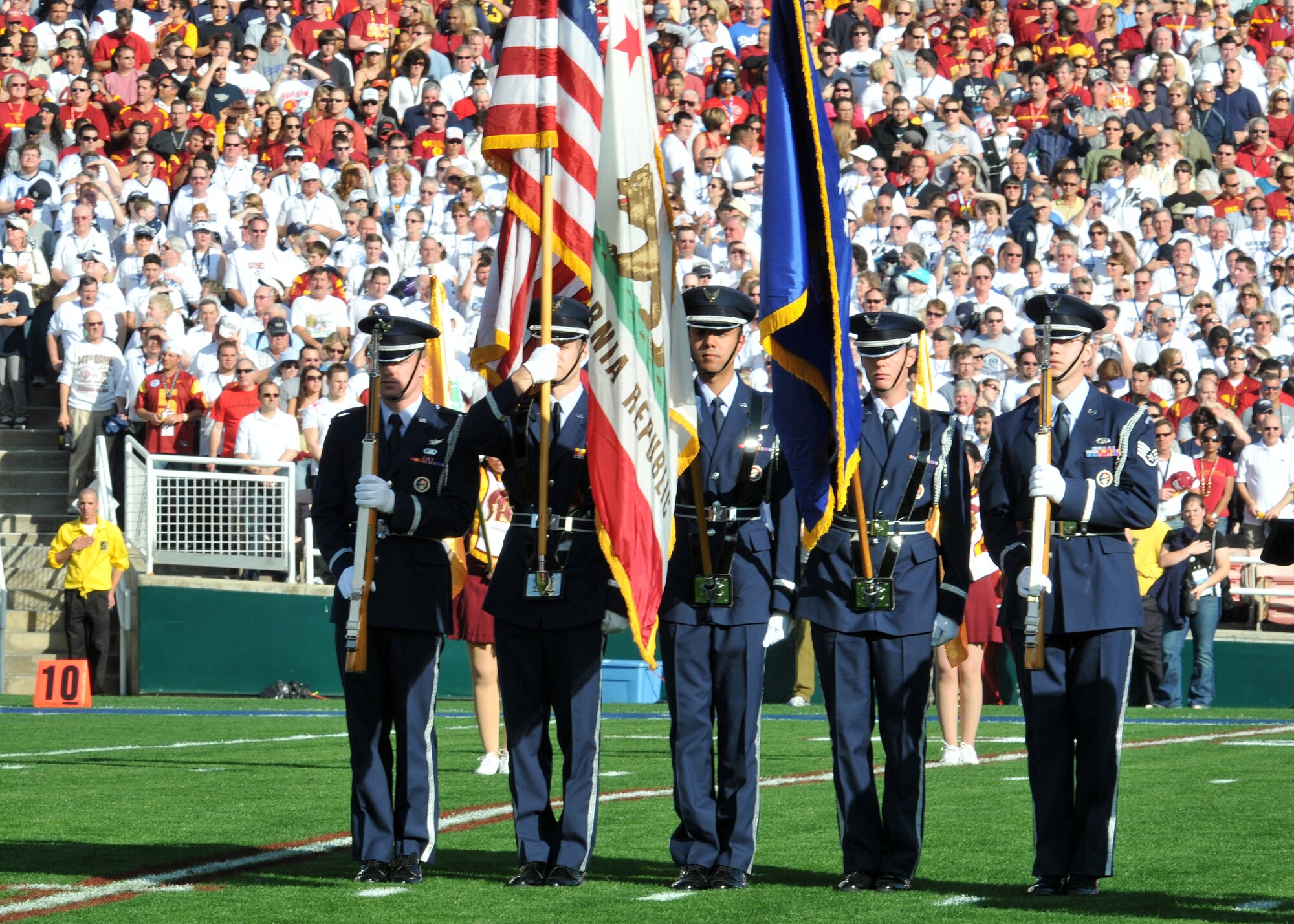 The Los Angeles Air Force Base Honor Guard presents the colors during the playing of the National Anthem at the Rose Bowl Stadium, Pasadena, Calif., Jan. 1. Gen. C. Robert Kehler, Air Force Space Command commander, Lt. Gen Tom Sheridan, Space and Missile Systems Center commander, Brig, Gen. Garrett Harencak, 509th Bomb Wing commander, and their spouses represented the Air Force during the 120th annual Tournament of Roses Parade and 95th Rose Bowl games. (Photo by Atiba Copeland)