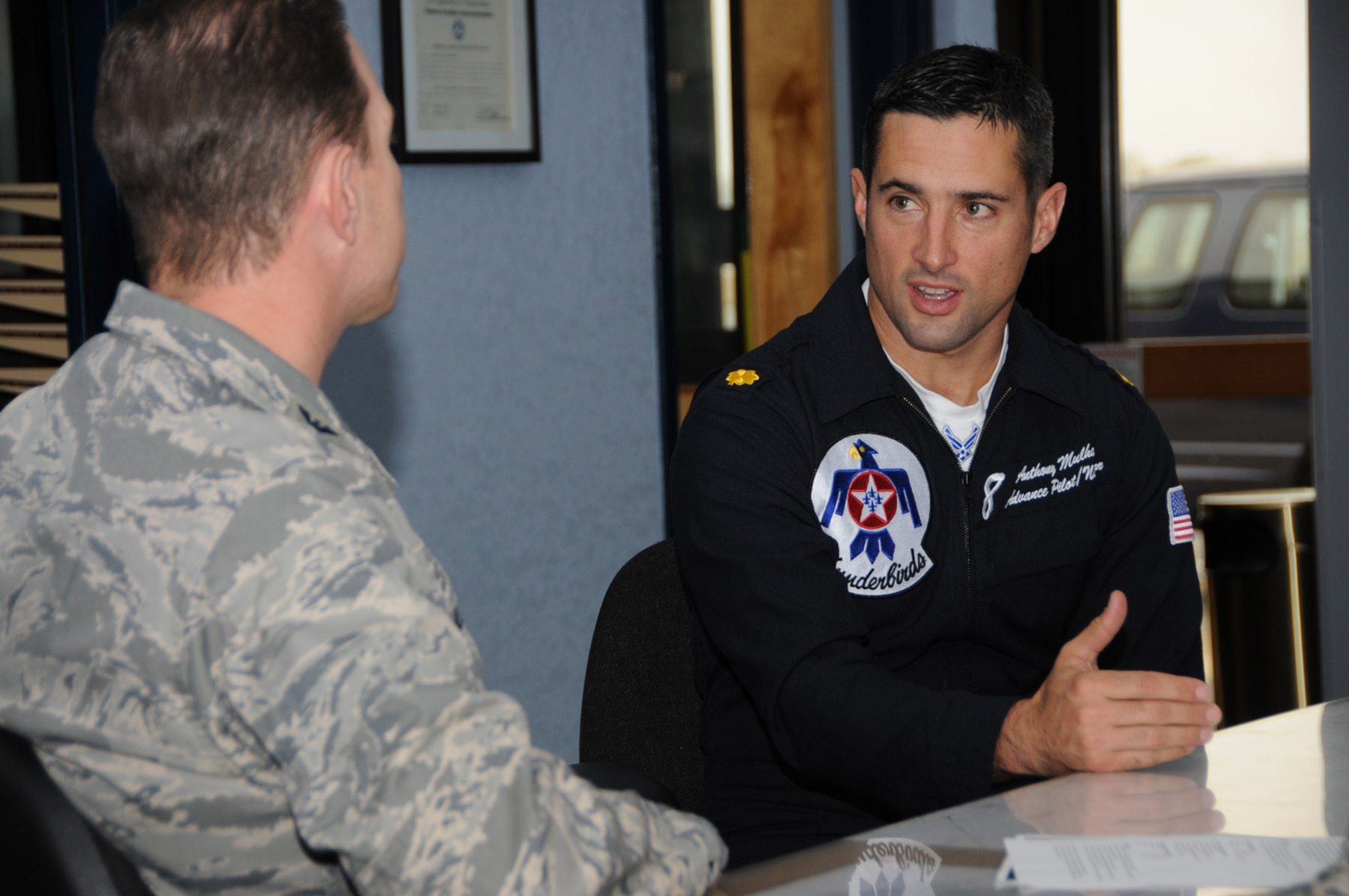 Col. Christopher Valle, left, 81st Training Wing vice commander, discusses airfield safety requirements with Maj. Anthony Mulhare, advance pilot/narrator for the Air Force Demonstration Squadron Thunderbirds.  Major Mulhare visited Keesler Dec. 16 to assess the base’s ability to meet those requirements before the team’s appearance at the base’s Thunder on the Bay Air Show, April 4-5.  Keesler is the Thunderbirds’ third stop this year, with more than 73 performances planned in the U.S., Europe and the Far East.  (U.S. Air Force photo by Kemberly Groue)