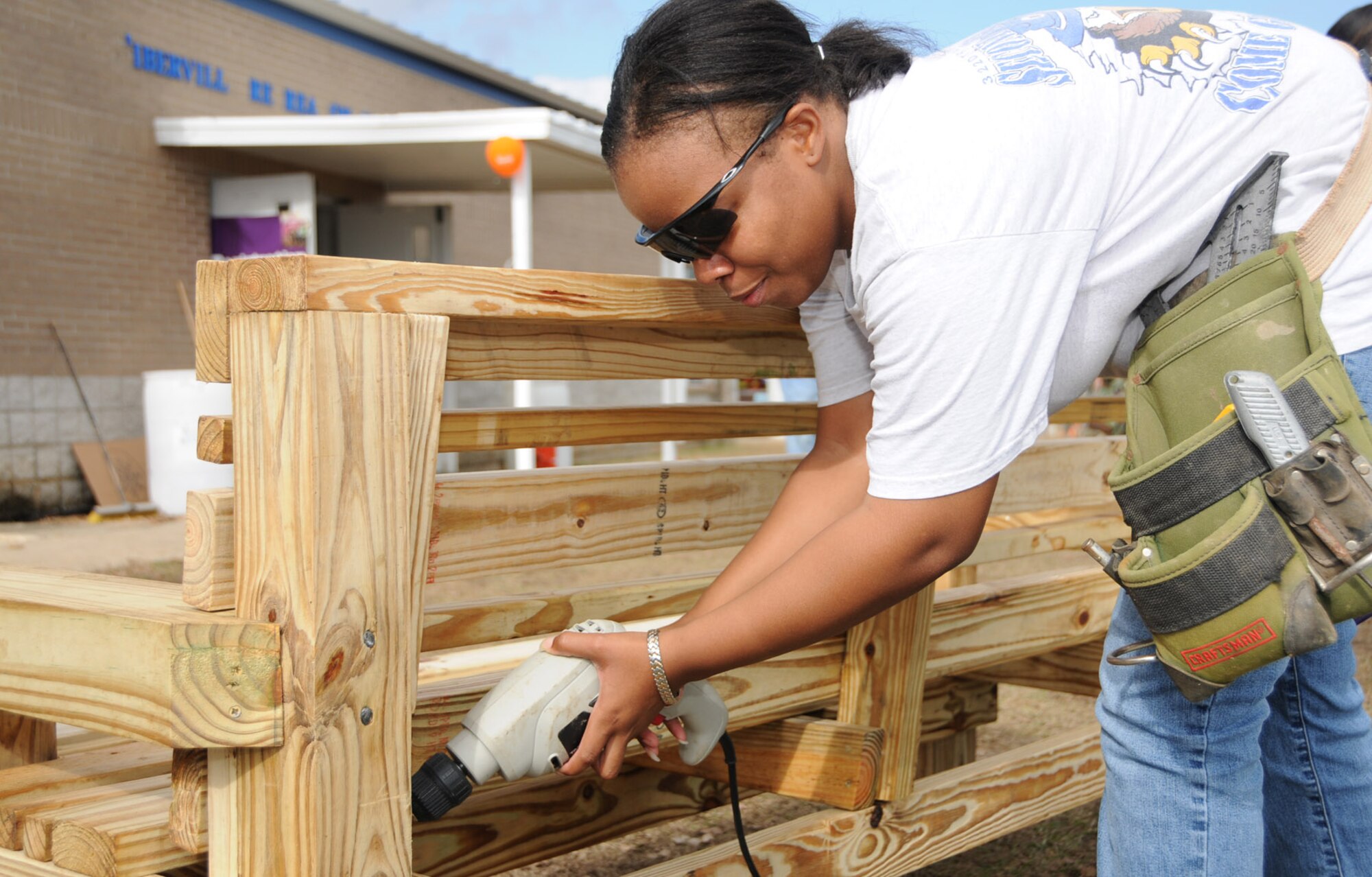 Airman 1st Class Shacoya Pittman, 81st Logistics Readiness Squadron, was one of the volunteers who worked on a new KaBOOM! playground behind D’Iberville Elementary School Dec. 19.  KaBOOM!, a national non-profit organization that empowers communities to build playgrounds, has coordinated the construction of more than 100 community playgrounds along the Mississippi Gulf Coast since Hurricane Katrina destroyed many of the area’s recreational facilities more than three years ago.  (U.S. Air Force photo by Kemberly Groue)
