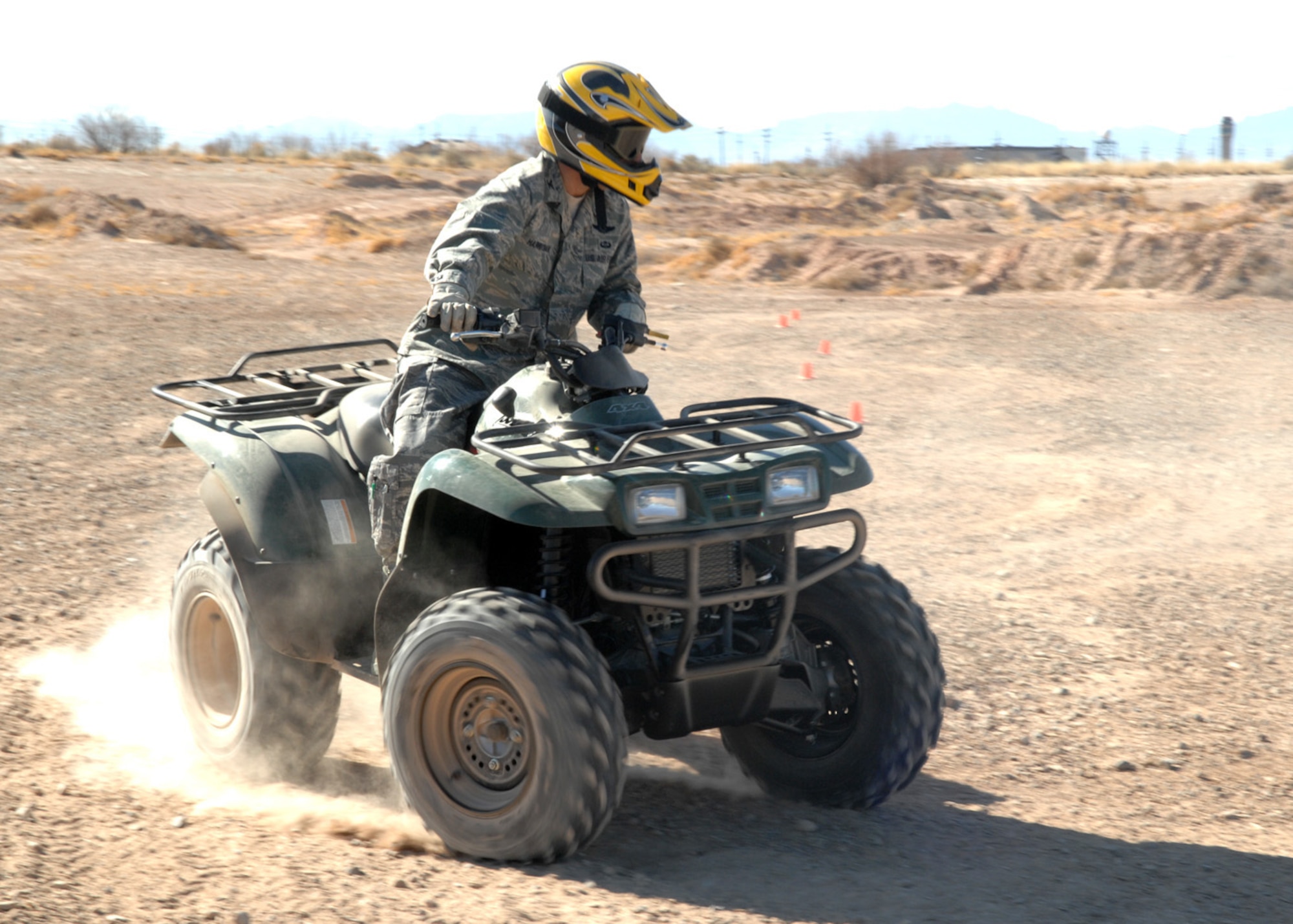 Col. Jeff Harrigian, 49th Fighter Wing commander, rides four wheeler at the Holloman all terrain vehicle and dirtbike track at Holloman Air Force Base, N.M., Jan. 5. As part of Safety Day activities, Airmen recieved an ATV demonstration guided by instructor, Dan Salinas, 49th FW Safety Office. (U.S. Air Force photo/Airman 1st Class Veronica Salgado)
