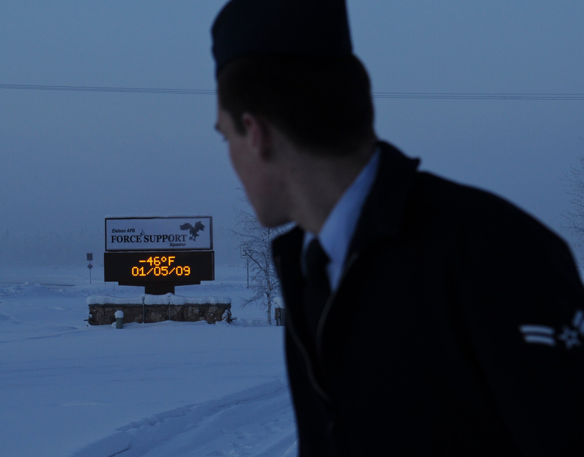 An Airman from Eielson Air Force Base, Alaska checks the temperature as he heads back to his vehicle Monday. The recent cold spell that has hit the interior of Alaska has had sub-zero temperatures dropping into the -50's and -60's during hours of darkness. Many precautions have been taken to maintain the mission while considering the safety of Eielson's Airmen.  (U.S. Air Force photo/Airman 1st Class Laura Max)