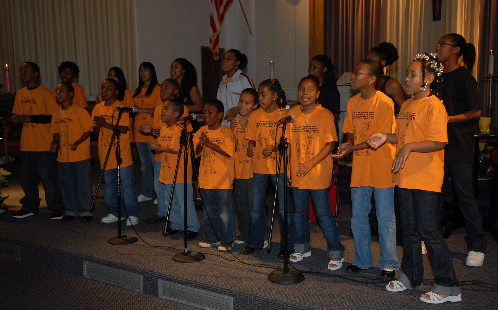 VANDENBERG AIR FORCE BASE, Calif. --  Children sing " I am a Friend of God" during Youth Sunday at Vandenberg's 11:30 gospel service. The 30th Space Wing chaplain office accomadates the spiritual needs of all Airmen. For more information on the different services held, as well as support for different faiths, call the chaplain's office at 606-5773. (U.S. Air Force photo / Airman 1st Class Antoinette Lyons)