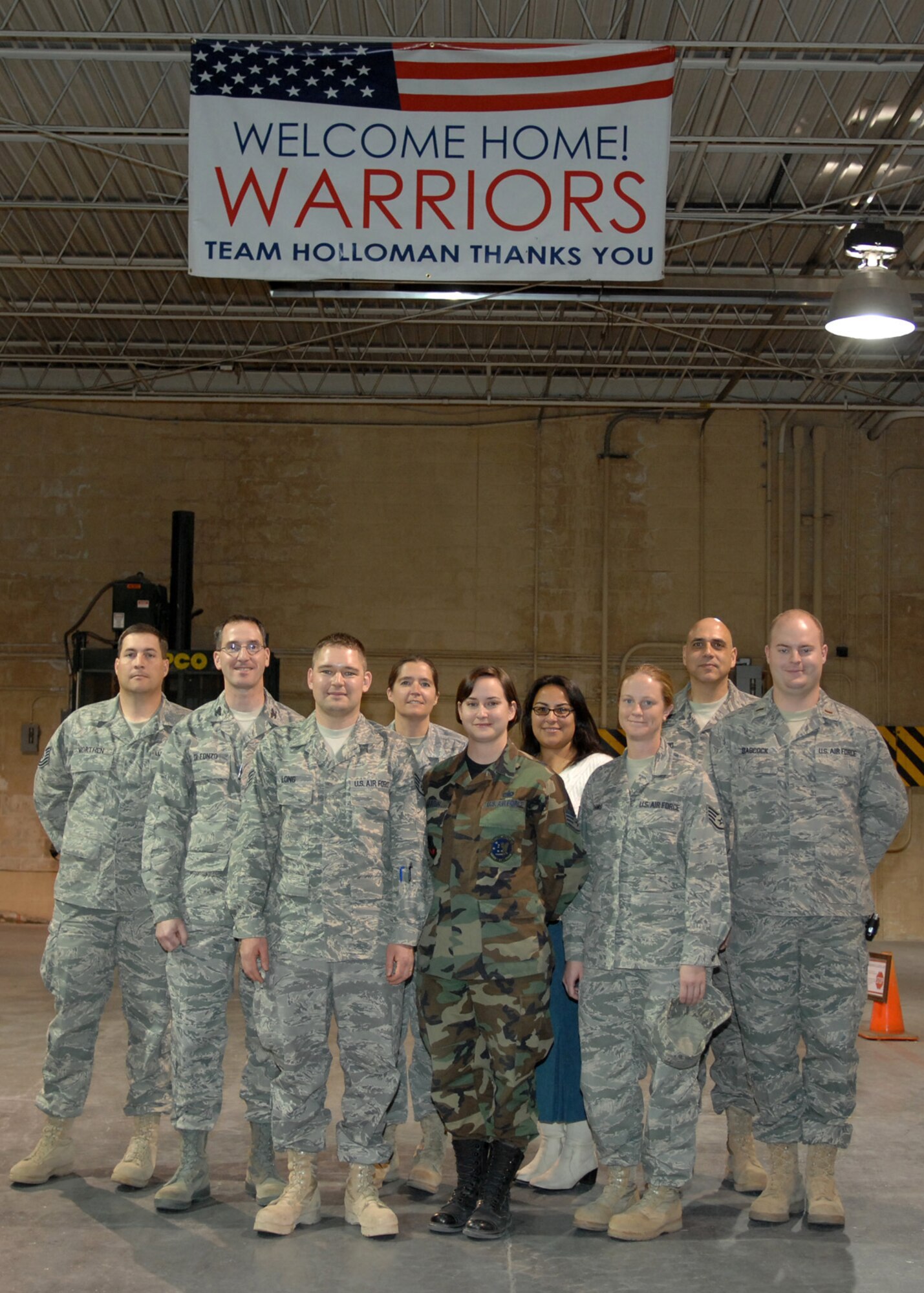 Staff Sgt. Mike Long, 49th Logistics Readiness Squadron, poses for a group photo with members of the 49th Mission Support Group after returning from his deployment Dec. 31 at Holloman Air Force Base, N.M. Sergeant Long was deployed to Iraq for six months. (U.S. Air Force photo by Airman 1st Class Veronica Salgado)