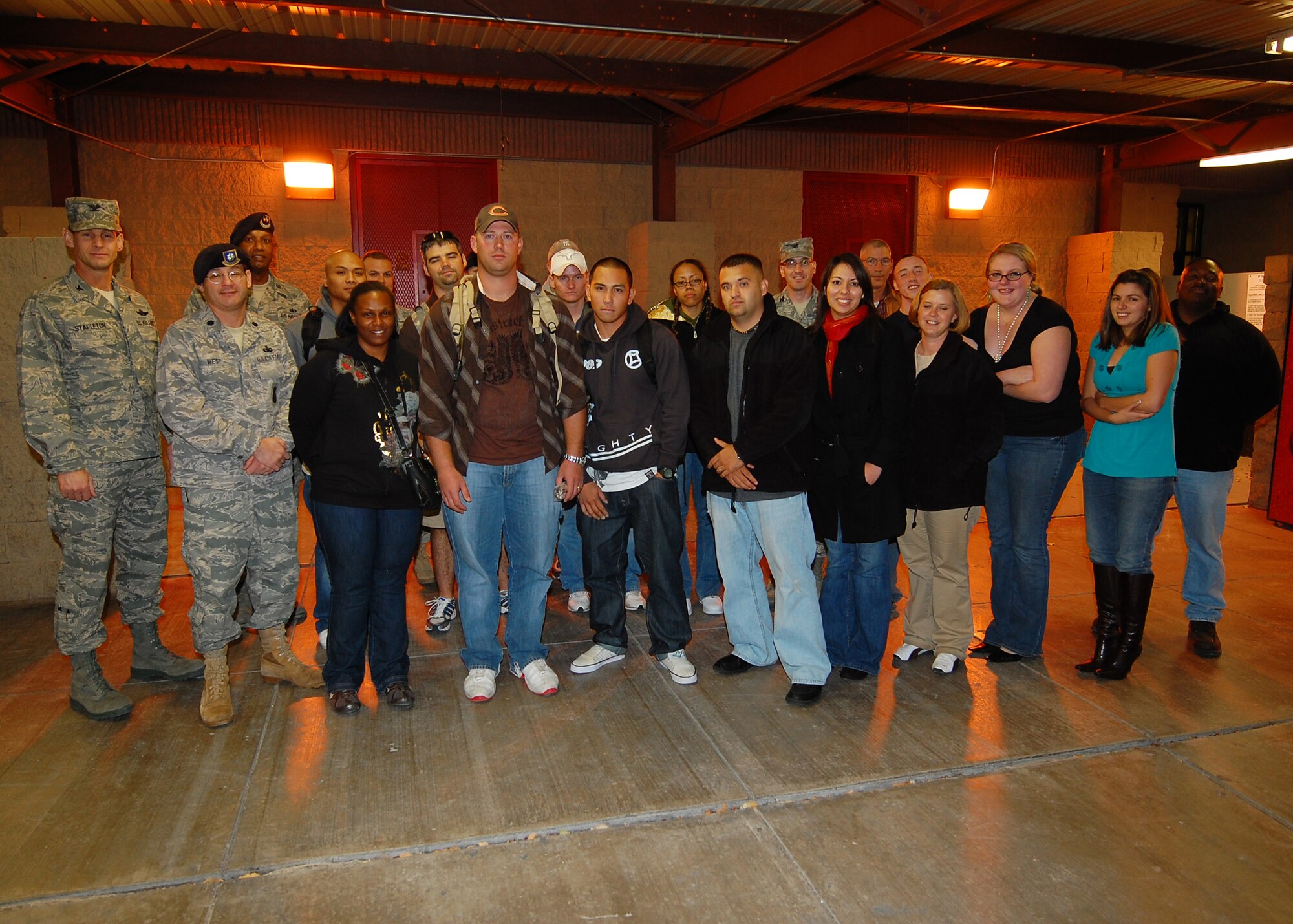 Members from the 49th Security Forces Squadron pose for a photo with commanders, family and friends upon their return from a deployment to Ecuador at Holloman Air Force Base, N.M., Dec. 23. (U.S. Air Force photo/Senior Airman Michael Means)