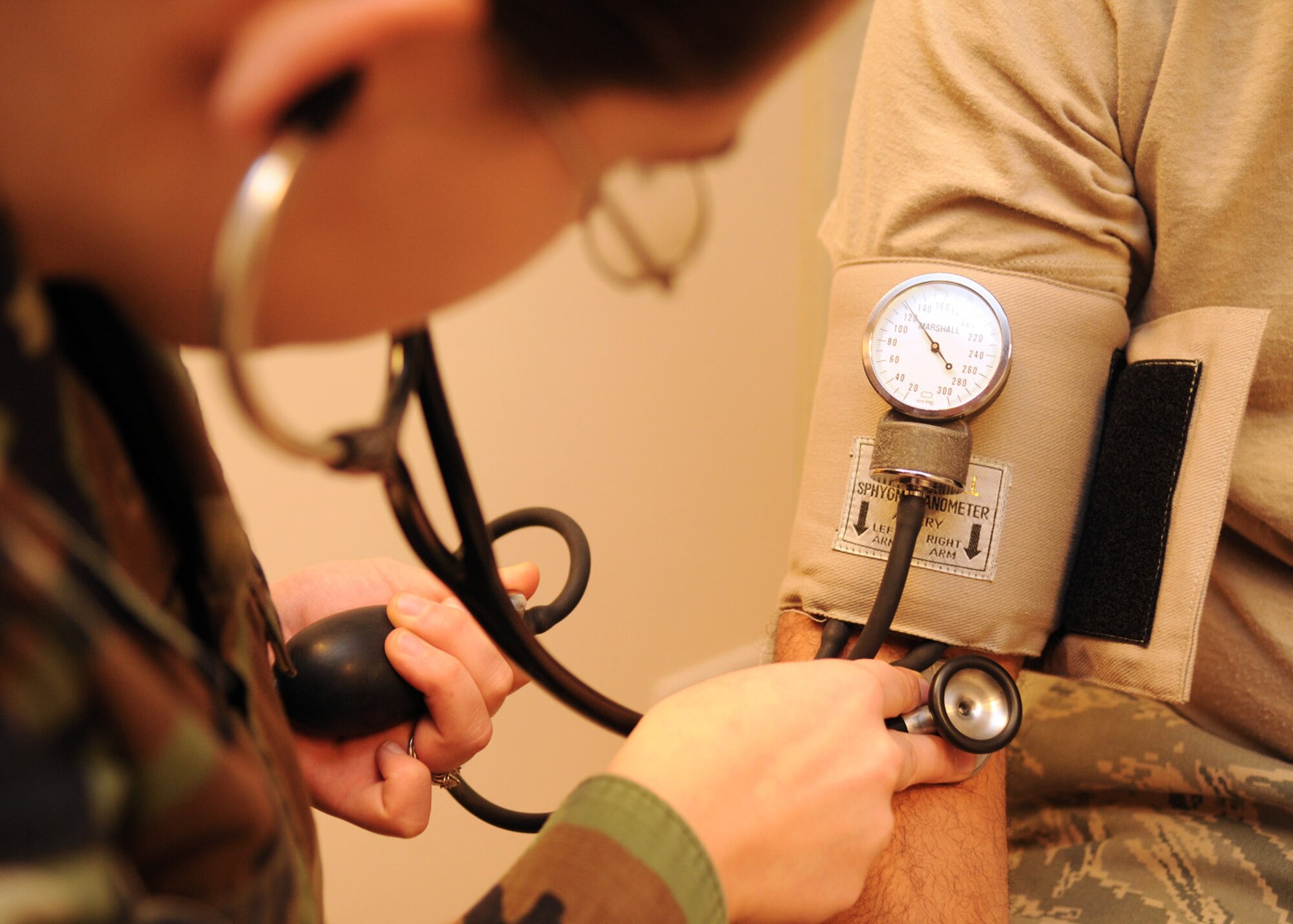 Airman 1st Class Bridget Williams, an aerospace medical technician apprentice from the 48th Aerospace Medical Squadron, checks the blood pressure of Staff Sgt. Antonio Planell during his annual preventive health assessment exam Dec. 16, 2008, at RAF Mildenhall, England. Flight medicine offers Mildenhall airman deploying or on flying status the convenience of on station services to satisfy general health care needs. (U.S. Air Force photo by Staff Sgt. Jerry Fleshman)