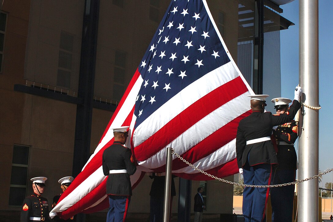 U.S. Marines raise the American flag during the dedication ceremony for the new U.S. Embassy in Baghdad, Jan. 5, 2009. U.S. Army photo by Sgt. 1st Class Derren J. Mazza