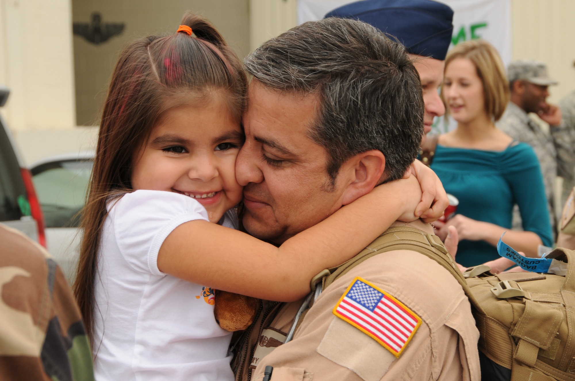 Tech. Sgt. Gregory Sisco, assigned to the 33rd Rescue Squadron, is greeted by his daughter at the 33rd Rescue Squadron, Kadena Air Base, Jan. 7, 2009. Sergeant Sisco is returning home from a 120-day deployment to Bagram Air Base, Afghanistan, in support of Operation Enduring Freedom. (U.S. Air Force photo by Staff Sgt Chrissy Best)