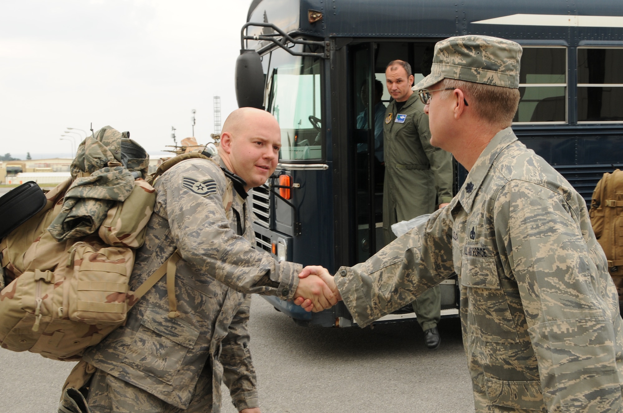 Staff Sgt. Michael Tice is greeted by Lt. Col Kurt Kolch, Commander of 718th Aircraft Maintenance Squadron, at the 33rd Rescue Squadron, Kadena Air Base, Jan. 7, 2009. SSgt Tice is returning home from a 120-day deployment to Bagram Air Base, Afghanistan, in support of Operation Enduring Freedom. (U.S. Air Force photo by Staff Sgt. Chrissy Best)