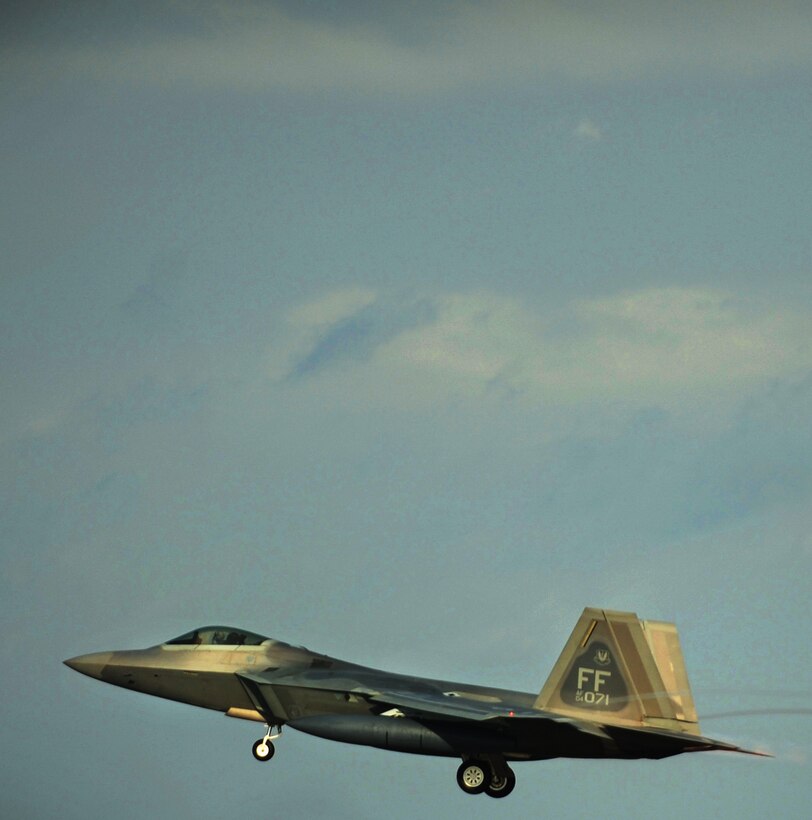 LANGLEY AIR FORCE BASE, Va. --  An F-22A Raptor from the 27th Fighter Squadron takes off for a deployment to Kadena Air Base, Japan, Jan. 7.  More than 200 personnel and 12 F-22A Raptors from the 27th Fighter Squadron departed for Japan for their Air Expeditionary Force deployment, which demonstrates the continued U.S. commitment to fulfill it security responsibilities through the Western Pacific. (U.S. Air Force photo/Senior Airman Vernon Young)