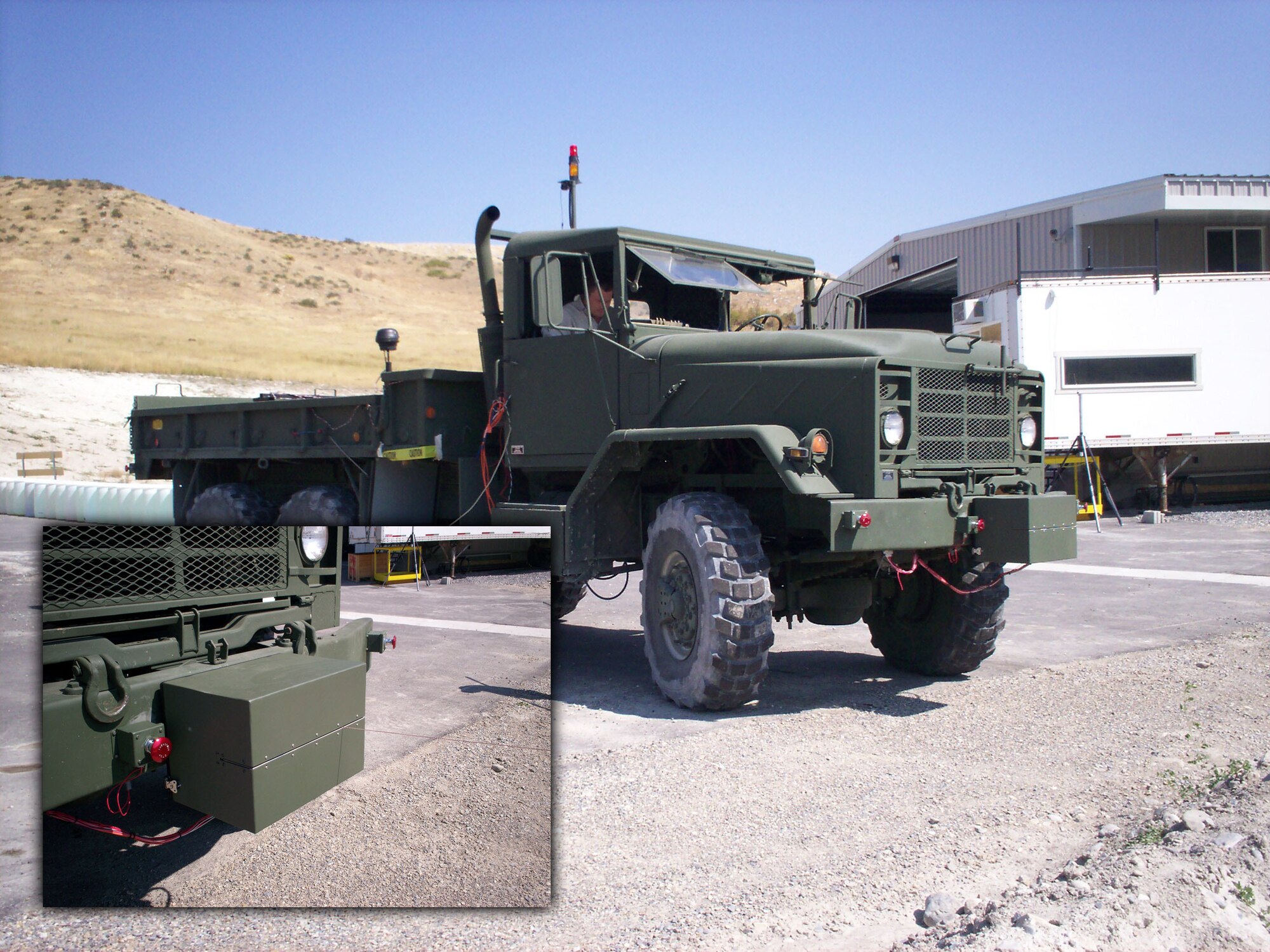 A military vehicle with a robotic package attached to the front bumper is shown.  The robotic package was designed to be used on convoy missions, allowing the driver to maintain situational awareness. Air Force researchers hope the technology will enable vehicle operators to focus less on mechanics of driving and more on looking for potential threats. (U.S. Air Force photo) 