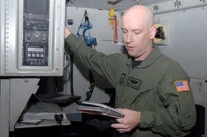 Tech. Sgt. Joshua Watson performs a pre-flight inspection of a C-17 at Charleston AFB, S.C. Jan 7.  Sergeant Watson was recently promoted through Stripes for Exceptional Performers on Jan 3rd. Sergeant Watson is a loadmaster with the 15th Airlift Squadron. (U.S. Air Force photo/Staff Sgt. Marie Cassetty)