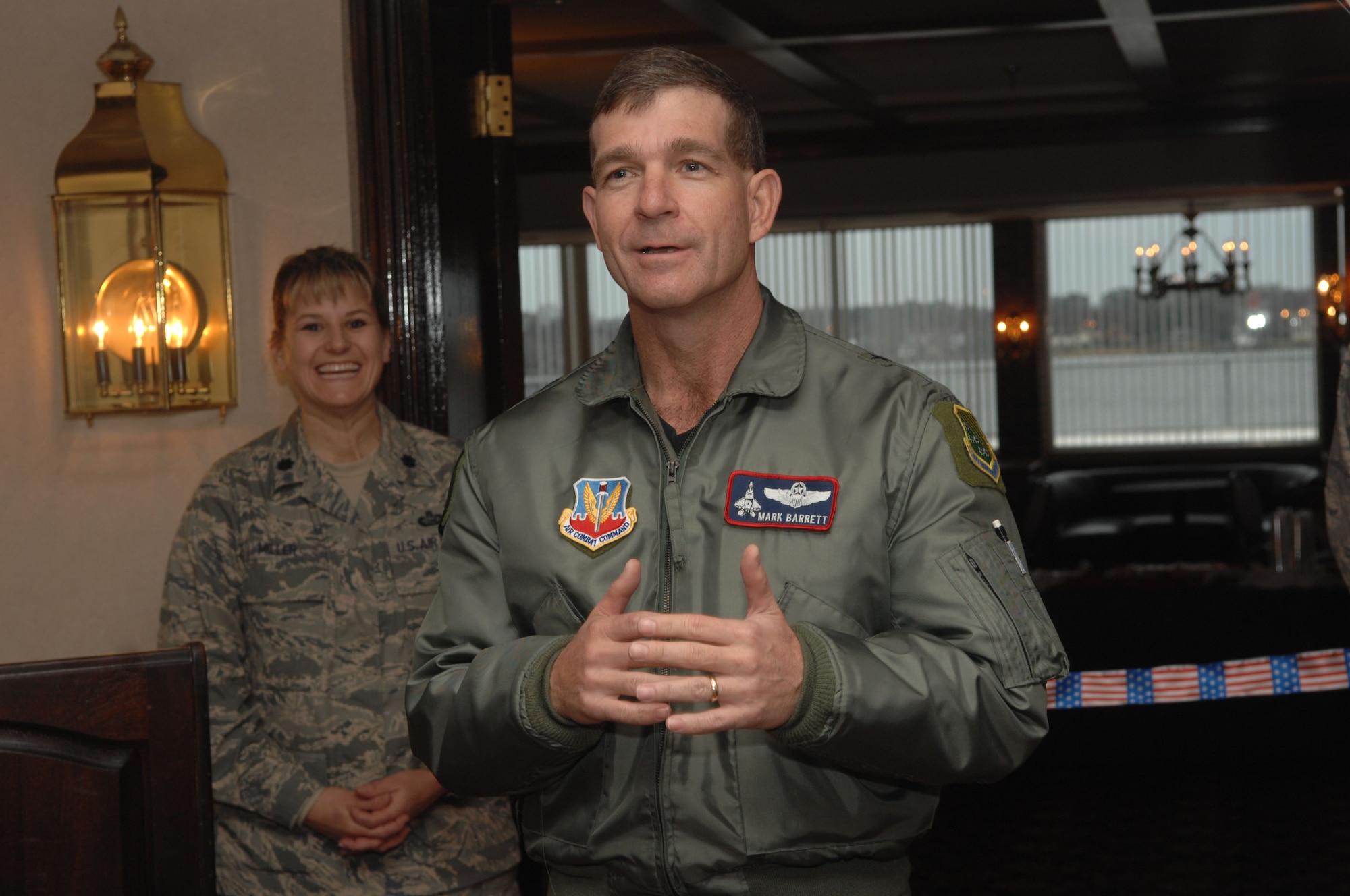 LANGLEY AIR FORCE BASE, Va. -- Brig. Gen. Mark Barrett, 1st Fighter Wing commander speaks about the success of the newly renovated officers club. General Barrett expressed his thanks to those who helped bring the club back to good standing. The Langley officers’ club was built in 1934 and after 70 years of normal wear and tear the infrastructure needed to be repaired. The club is now fully equipped with new electrical systems, plumbing, a brand new heating/cooling system, elevator to the second floor and handicap accessible restrooms. (U.S. Air Force Photo/Senior Airman Cecil C. McCloud)