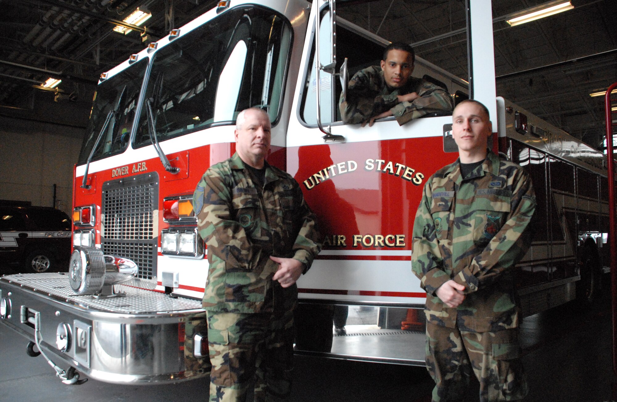 (Left to right) Senior Master Sgt. Timothy Brown, 436th Civil Engineer Squadron Fire Chief, and Airman 1st Class Christopher Kynard and Airman Zachary Mandevill, 436th Civil Engineer Squadron firefighters, are unit representatives for the Dover Airmen Against Drunk Driving program. The 436th CES Fire Department has volunteered to pick up Airmen who call the DAADD program when there are no other volunteers. (U.S. Air Force photo/ Airman 1st Class Shen-Chia Chu)