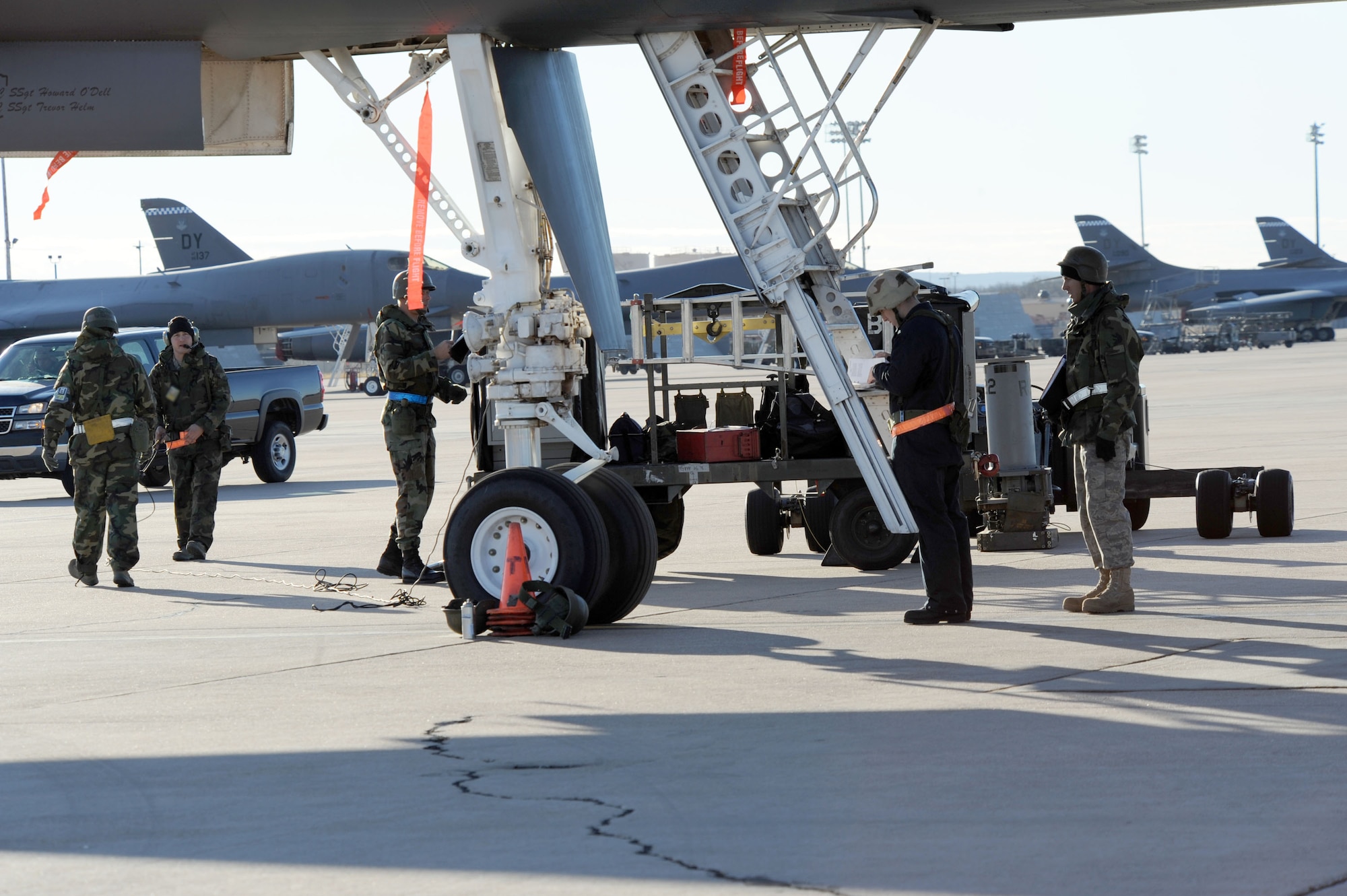 DYESS AIR FORCE BASE, Texas -- Members of the 7th Bomb Wing maintain and load weapons on the B-1B Lancer during the operational readiness inspection here, Jan. 6.  Properly maintaining and loading bombs on the B-1B is crucial to Dyess' mission success.  (U.S. Air Force photo by Staff Sgt. Darcie Ibidapo)