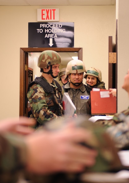 DYESS AIR FORCE BASE, Texas -- Airman 1st Class Jacob Williams processes through the personnel deployment function (PDF) line during the operational readiness inspection here, Jan. 6.  Deployers process through the PDF line to ensure that all required actions are complete prior to departure.  (U.S. Air Force photo by Staff Sgt. Darcie Ibidapo)