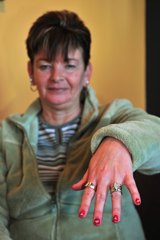 Cindy Barnhill shows off her patriotic fingernails at a Starbucks Coffee store in Centennial Colo., Dec. 29, 2008. In a personal mission spanning two and a half years, Barnhill, of Parker, Colo., has singlehandedly purchased more than $15,000 worth of coffee for service members and first responders in the two communities south of Denver. (Official U.S. Air Force photo by Tech. Sgt. Cheresa D. Theiral, Colorado National Guard) (Released)