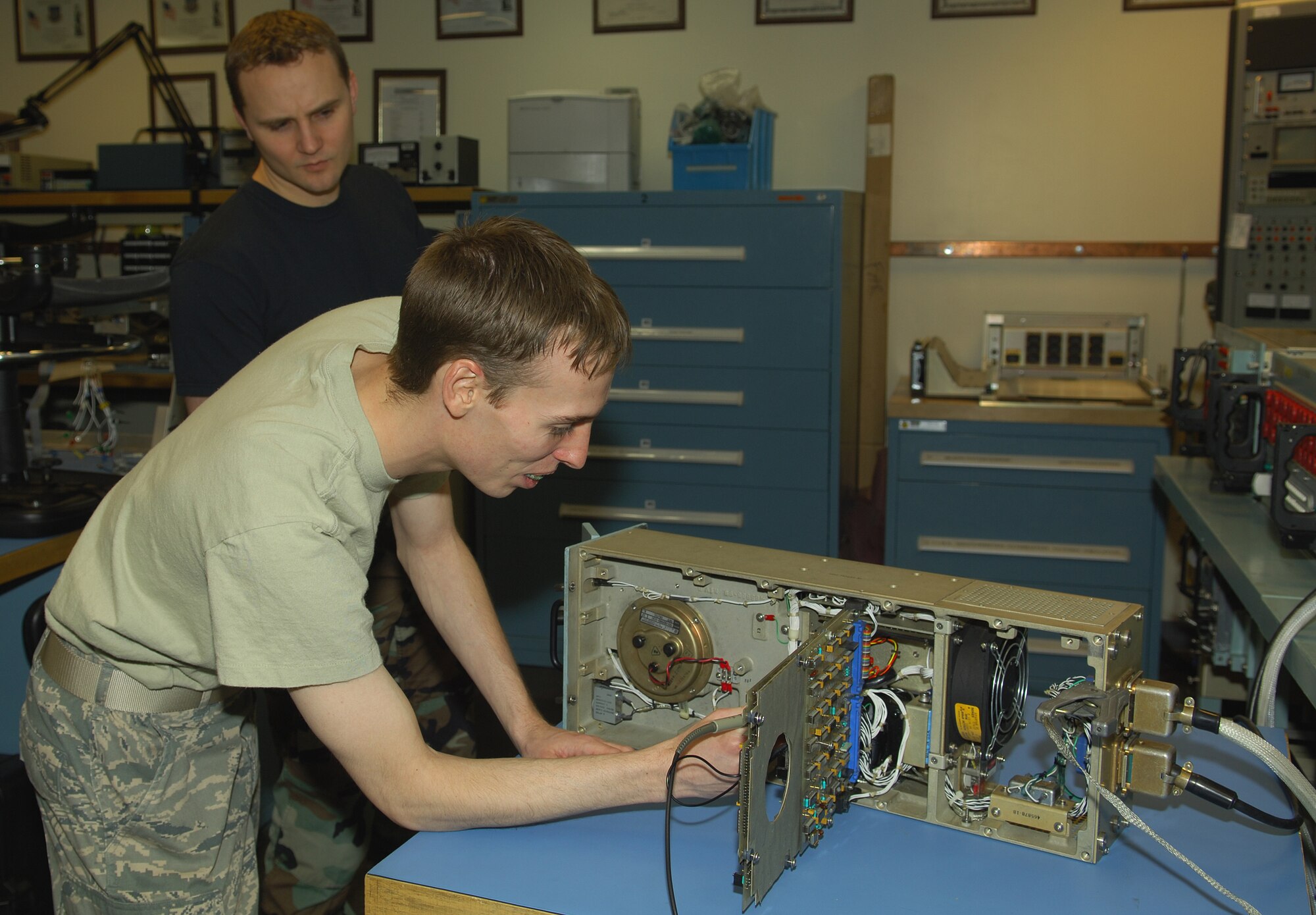 MINOT AIR FORCE BASE, N.D. – Airman 1st Class Apollo Timbers, an electro-mechanical team journeyman from the 91st Missile Maintenance Squadron missile communications office, troubleshoots a mass storage unit while Senior Airman James Jones, a 91st MMXS STRATCOM apprentice, assists him here Jan. 6. Airman from the missile communications office routinely perform maintenance on many pieces of equipment from both the 91st Missile Wing and the 5th Bomb Wing. (U.S. Air Force photo by Senior Airman Cassandra Jones)