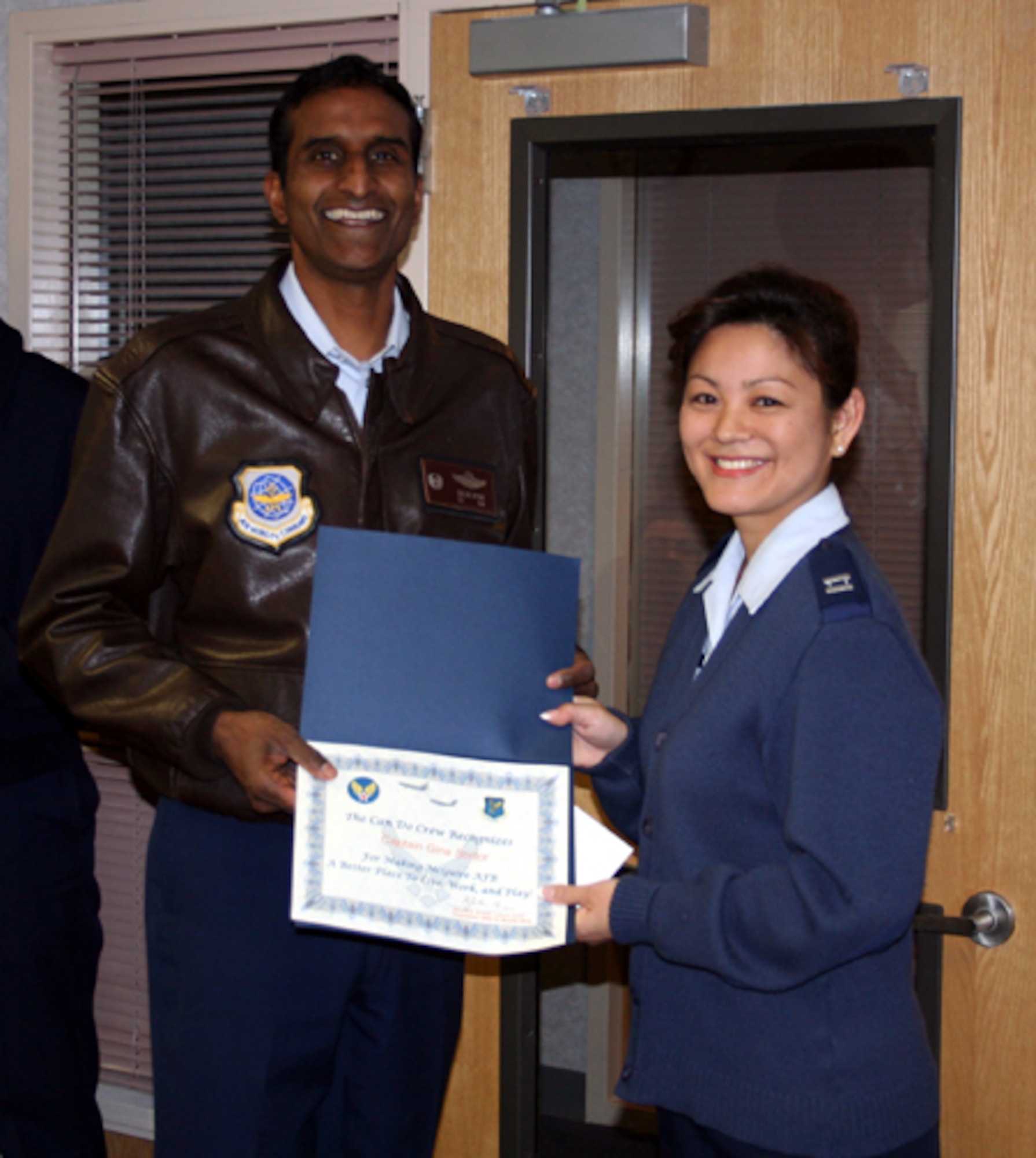 Left, Col. Balan Ayyar, 305th Air Mobility Wing commander, presents a Can Do Crew award to Capt. Gina Sortor, 305th Contracting Squadron. Captain Sortor has been instrumental in delivering unsurpassed leadership and mission support to the 305th CONS while back-filling for several 305th CONS deployed members. Captain Sortor demonstrated singular leadership and exceptional management skills by personally working with the Military Personnel Element to validate late performance reports, decorations, and other personnel programs. She worked innumerable hours and countless weekends to return the 305th CONS personnel program to superior caliber. This required her to assist multiple supervisors in crafting the required documents. Captain Sortor implemented a one-shop review process, which reduced the cycle time from 21 days to a mere seven days to include transit time. She has implemented numerous other process improvements for reducing cost and man-hours. With low manning (62 percent) and ever-increasing requirements, Captain Sortor has had the greatest impact on sustaining and improving the 305th CONS personnel programs.     

Be aware that the Can Do Crew is everywhere, looking for outstanding service.  They covertly seek members of Team McGuire who make a difference, identifying and recognizing only the best! Remember, the strongest asset of Team McGuire is its people; you are what makes McGuire a better place to live, work and play!