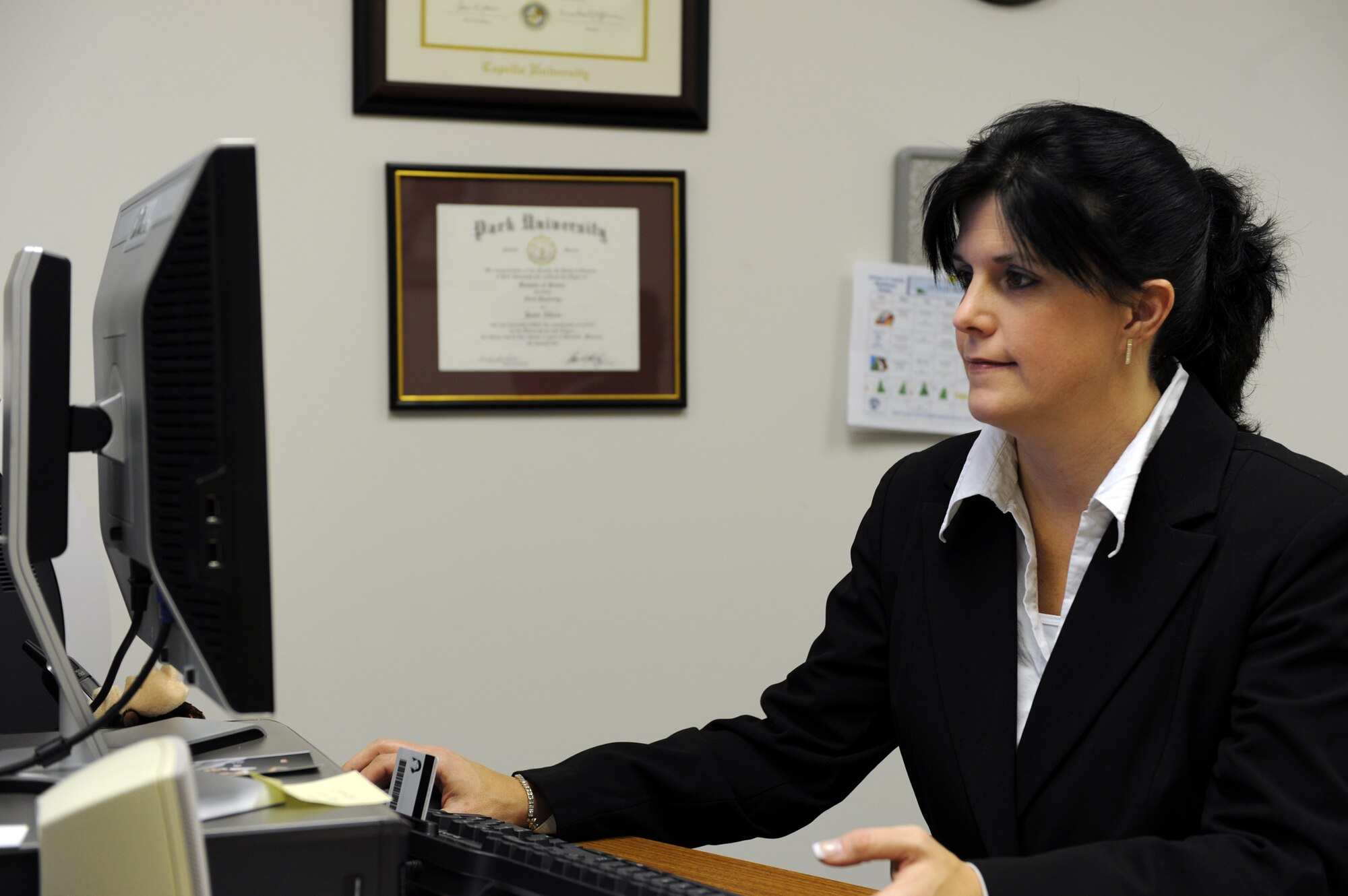 WHITEMAN AIR FORCE BASE, Mo. - Jamie Albers, Whiteman’s School Liaison Officer, responds to email inquiries Jan. 7. Whiteman’s Airmen and Family Readiness Center recently added a school liaison officer position to deal with issues that range from those related to military life, such as the impact of deployments, to those more educational, such as curriculum and standards of local schools. (U.S. Air Force photo/Senior Airman Stephen Linch)