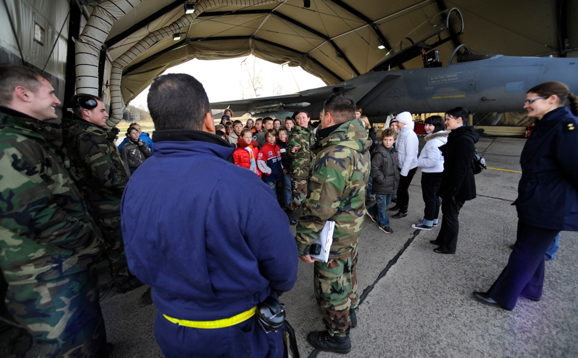 Children from local schools ask questions about the F-15 Eagle during a base visit in Siauliai, Lithuania. The 493rd Expeditionary Fighter Squadron was deployed from October to January in support of the NATO Baltic Air Policing mission. (U,S. Air Force photo by Staff Sgt. Brian Ferguson)