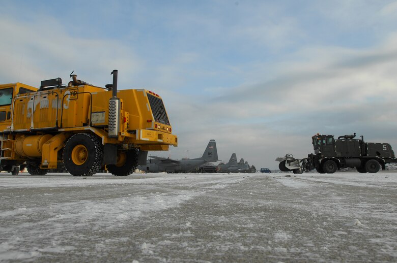 Members of Ramstein Air Field Management use a snow removal truck to clear snow off ramp one Jan. 6, 2008, before the day's mission. (U.S. Air Force photo by Airman 1st Class Kenny Holston)