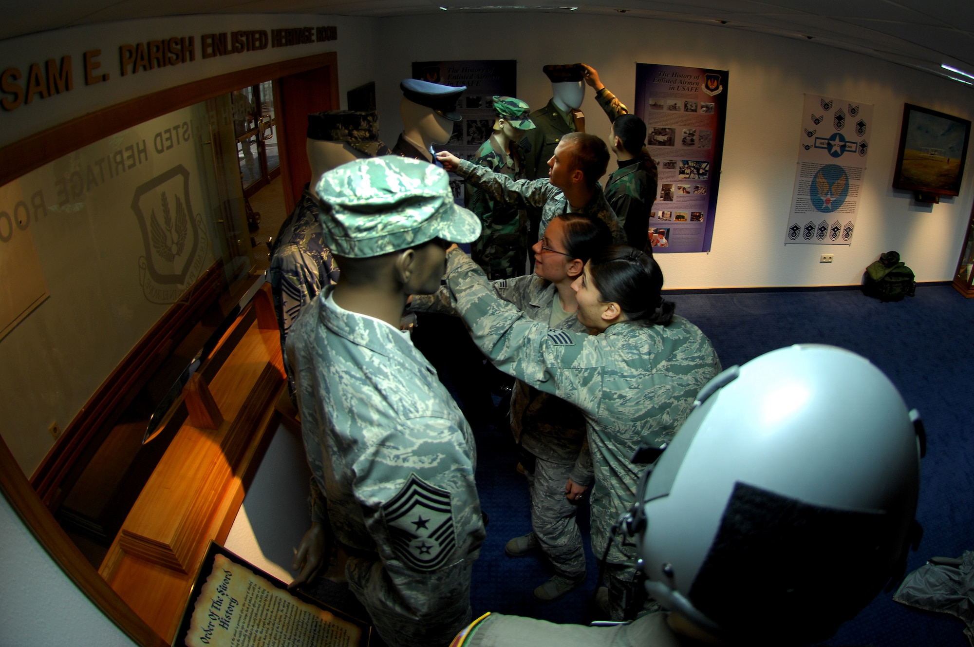 Air Force members take a tour of the Ramstein Air Base Enlisted Heritage Hall Jan. 6, 2009. The hall displays an array of different Air Force enlisted artifacts. (U.S. Air Force photo by Airman 1st Class Kenny Holston)