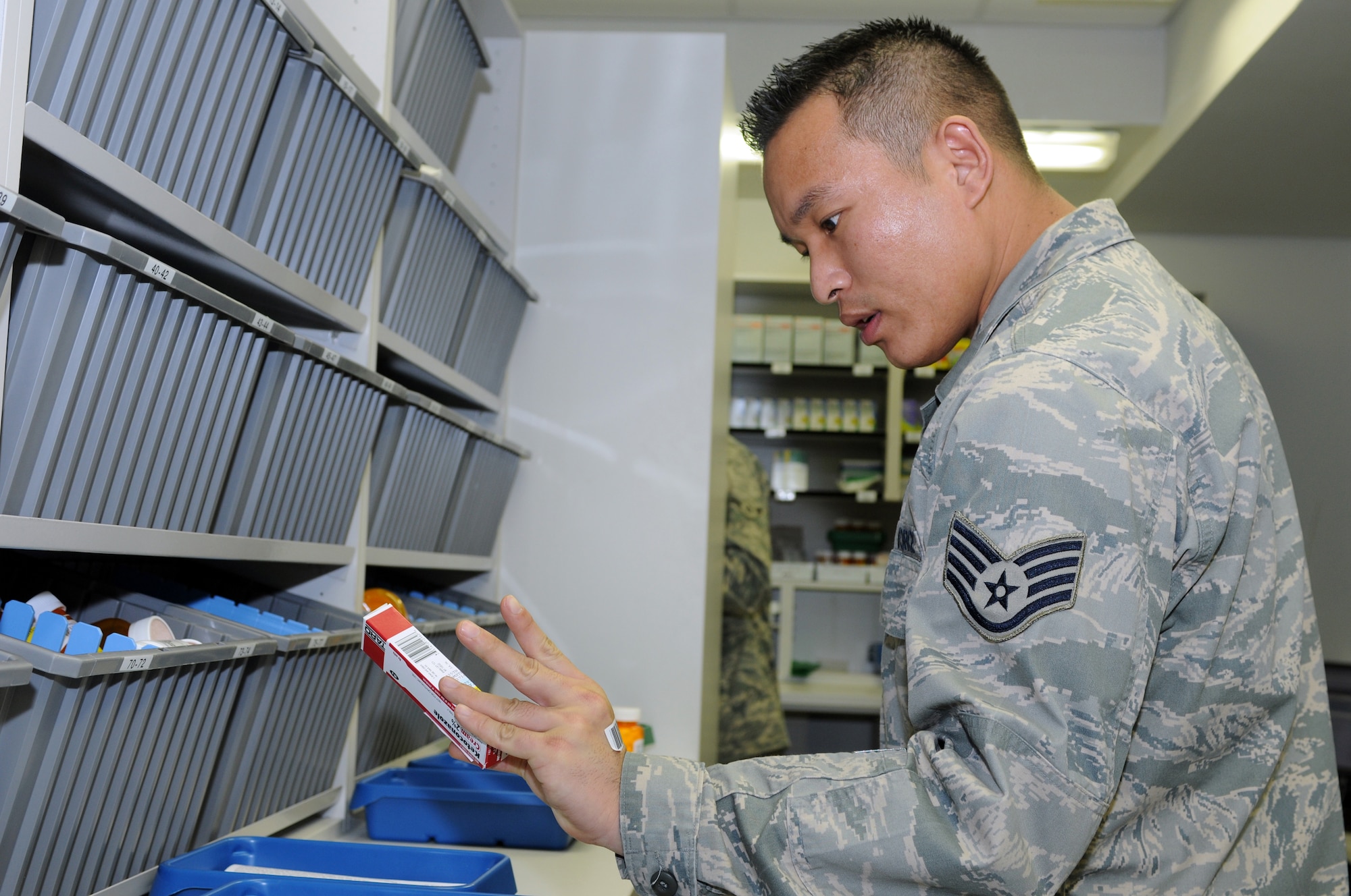 Staff Sgt. Tsering Chophel, 435th Medical Operations Squadron pharmacy technician, finds a prescription for a customer at Ramstein Air Base Jan. 6, 2009. The Ramstein pharmacy fills an average of 115,000 prescriptions a year and is the second busiest pharmacy in U.S. Air Forces in Europe. (U.S. Air Force photo by Senior Airman Kelly LeGuillon)