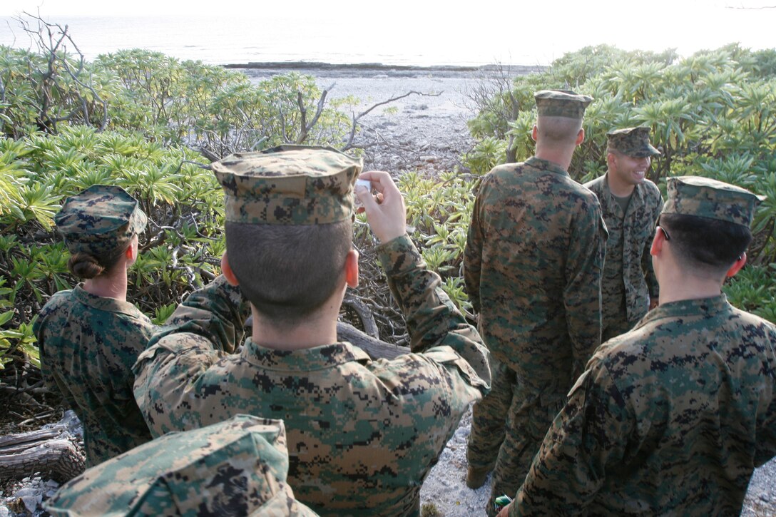 Shortly after landing on Wake Island on Jan. 8, 2009, Marines from Marine Attack Squadron 211 get a firsthand look at the remote Pacific atoll's jagged coral beaches where waves of a Japanese invasion force landed in 1941 only to be met by fierce resistance by Marine defenders including some from Marine Fighter Squadron 211. The return of VMA-211 on Jan. 8 to the remote Pacific atoll marks the first time since May 1993 the bulk of the squadron, nicknamed the "Wake Island Avengers," has returned to its symbolic birthplace. VMA-211 is based in Yuma, Ariz. (Photo by Gunnery Sgt. Bill Lisbon)