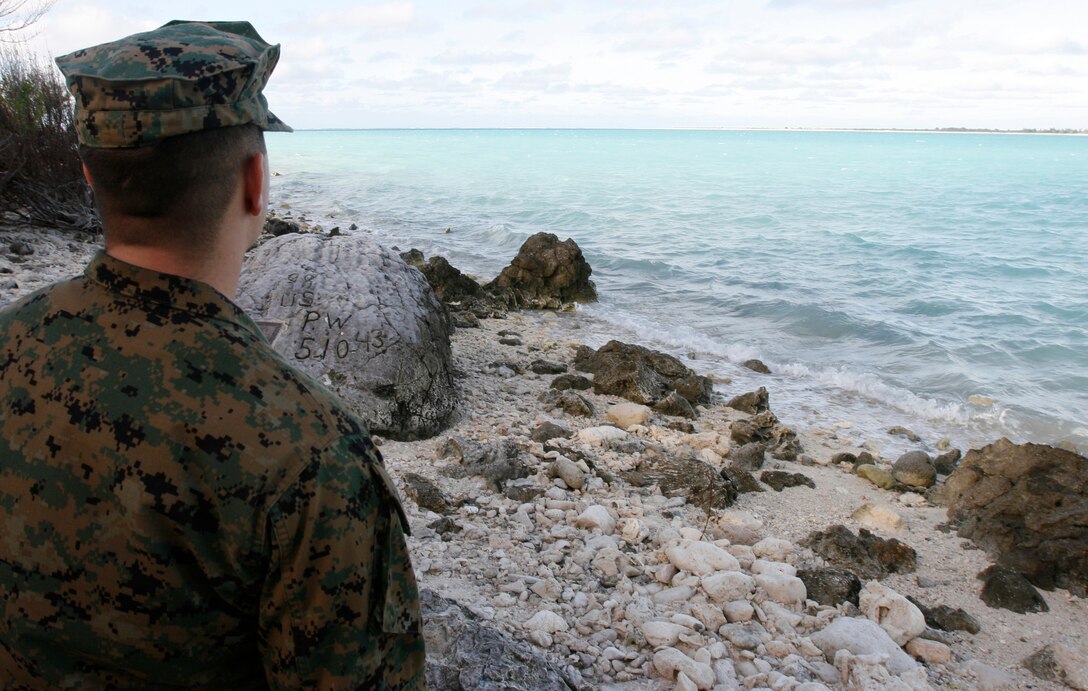 Cpl. Josh Nesbit, a powerline mechanic with Marine Attack Squadron 211, looks out at the lagoon in the center of the Wake Island atoll Jan. 8, 2009, during a tour of the island where the where a handful of the unit's Marines helped defend the island from an overwhelming Japanese invasion force from December 8-23 in 1941 before it was captured. The squadron, nicknamed the "Wake Island Avengers," returned to its symbolic birthplace en route to Iwakuni, Japan, where it attached to the 31st Marine Expeditionary Unit for a seven- to nine-month deployment. VMA-211 is based in Yuma, Ariz. (Photo by Gunnery Sgt. Bill Lisbon)