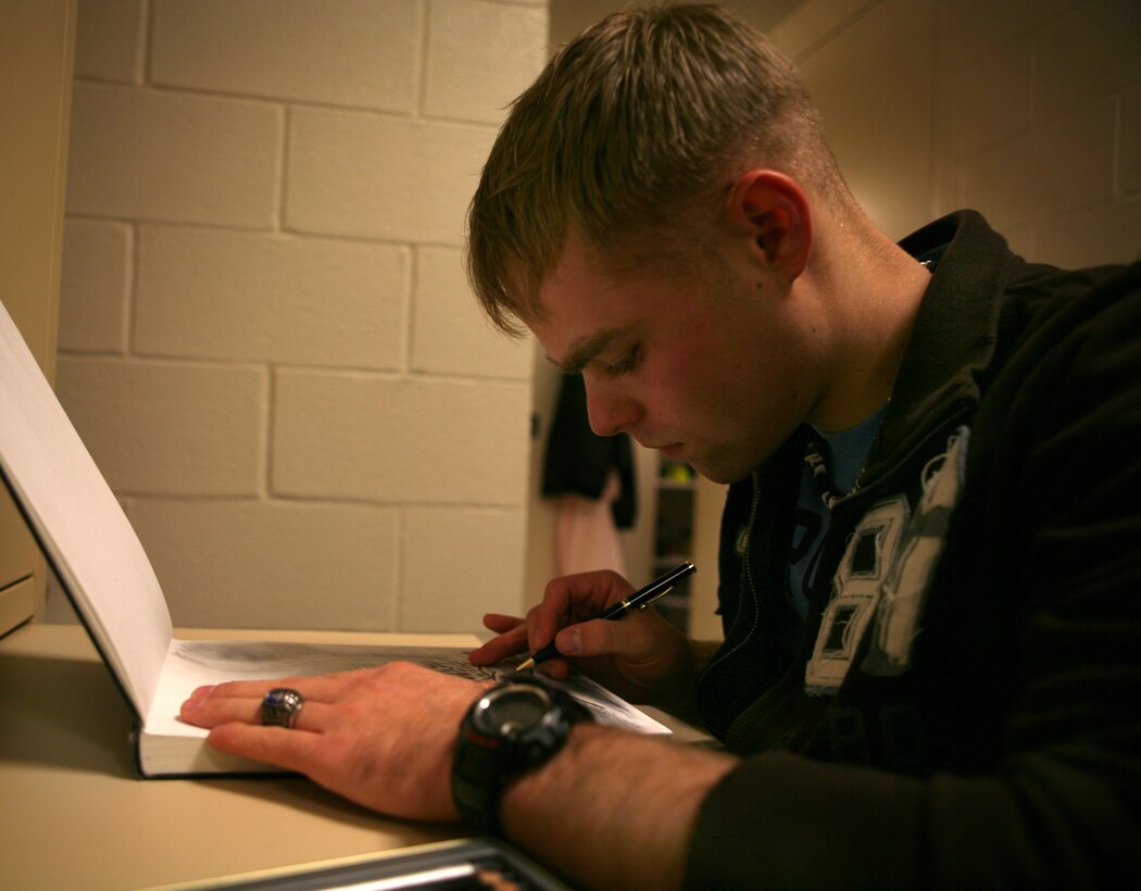 Seaman Patrick J. Brock, a corpsman with Combat Logistics Regiment 2's Regimental Aide Station, uses his artistic hobby, drawing, to melt away work-related stress, here, Jan 8.  Brock plans to take college art classes, but even more so, he desires to pursue a career in the medical field.