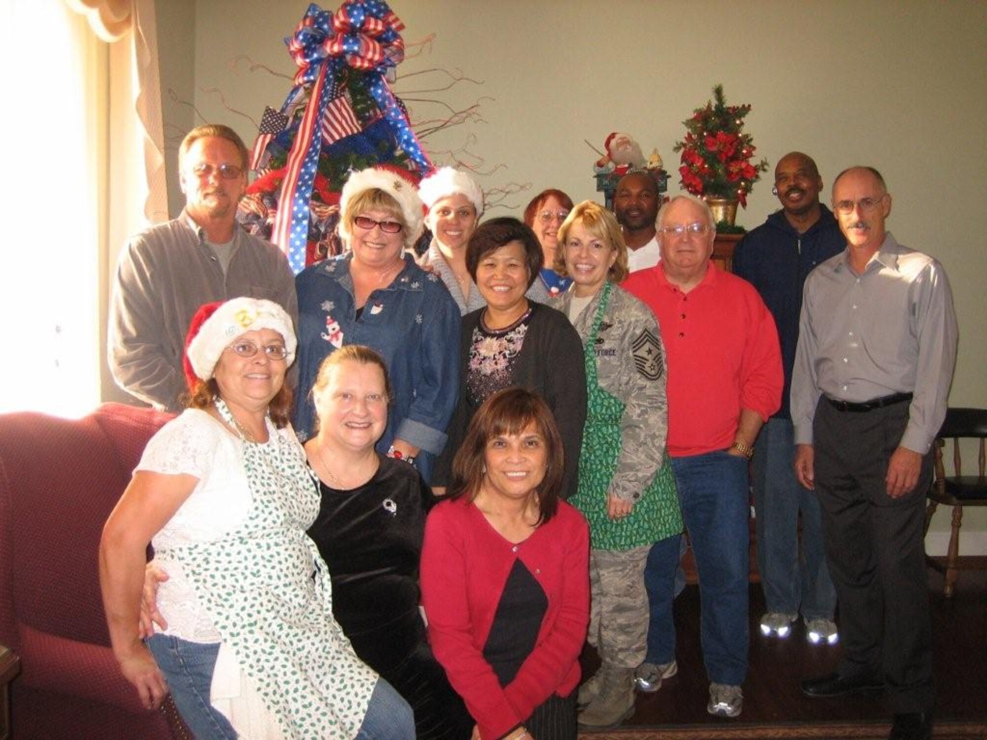Military and civilian personnel working Christmas Day were fed by volunteers from March ARB (some of whom are pictured). Workers were invited to dine at the Arnold House before/after their shifts, and meals were delivered to those unable to leave their work sites. (U.S. Air Force photo by Lt. Col. June Park)