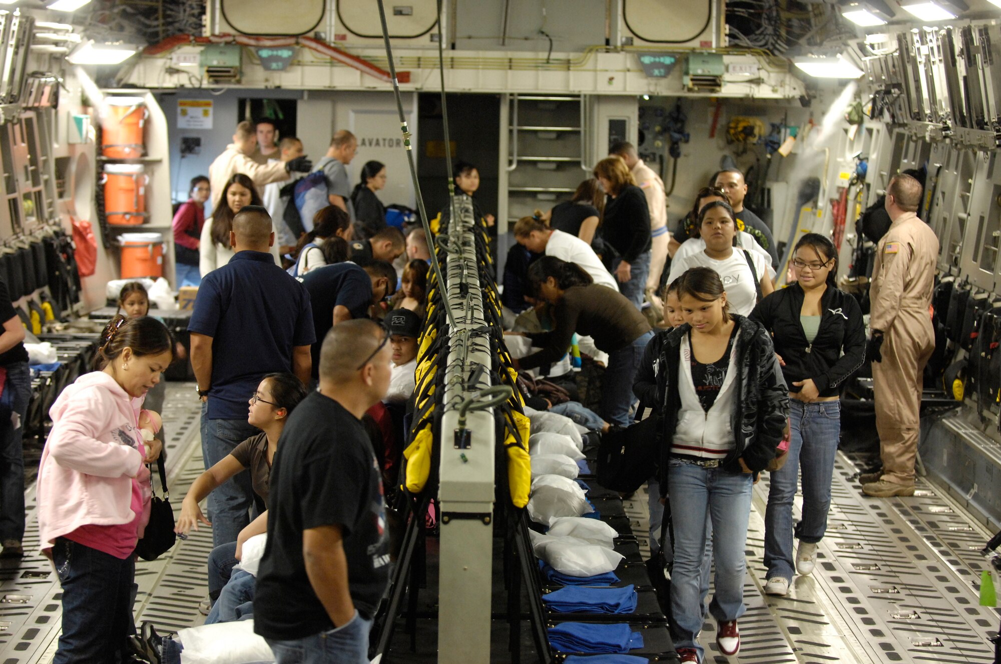 Passengers board a C-17 Globemaster III Dec. 17, 2008, at Hickam Air Force Base, Hawaii. The jet transported supplies to warfighters in Afghanistan. (U.S. Air Force photo/Tech. Sgt. Cohen A. Young) 
