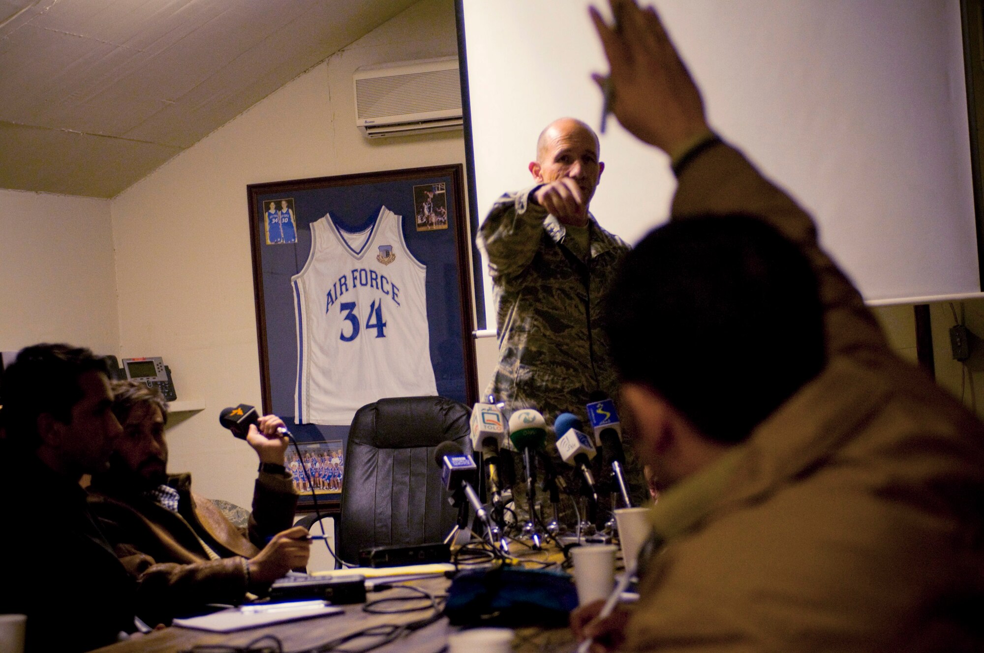 Brig. Gen. James M. "Mike" Holmes takes a question from an Afghan reporter during Afghan Media Day Jan. 5 at Bagram Airfield, Afghanistan. Following the general's briefing on close-air support, many reporters asked about the Air Force's effort to minimize civilian casualties. General Holmes is the 455th Air Expeditionary Wing commander. (U.S. Air Force photo/Staff Sgt. Samuel Morse)
