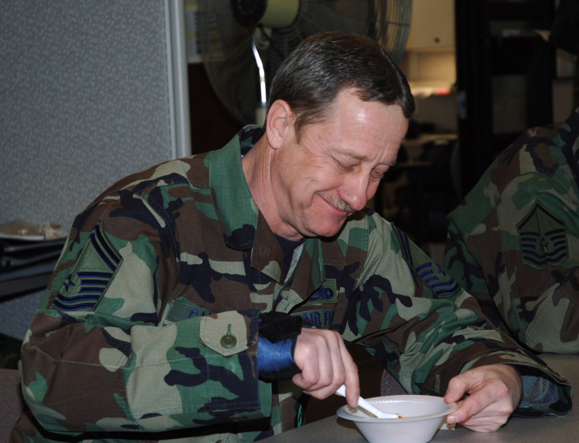 Senior Master Sgt. Lloyd Campbell enjoys the camradarie at the 931st Aircraft Maintenance Squadron's annual chili feed in 2008. The squadron's 2009 contest is scheduled for March 15, the Sunday of the March Unit Training Assembly. Sergeant Campbell is a maintenance squadron flight chief. His squadron is part of the 931st Air Refueling Group, an Air Force Reserve unit at McConnell Air Force Base, Kan. (U.S. Air Force photo/Tech. Sgt. Jason Schaap)