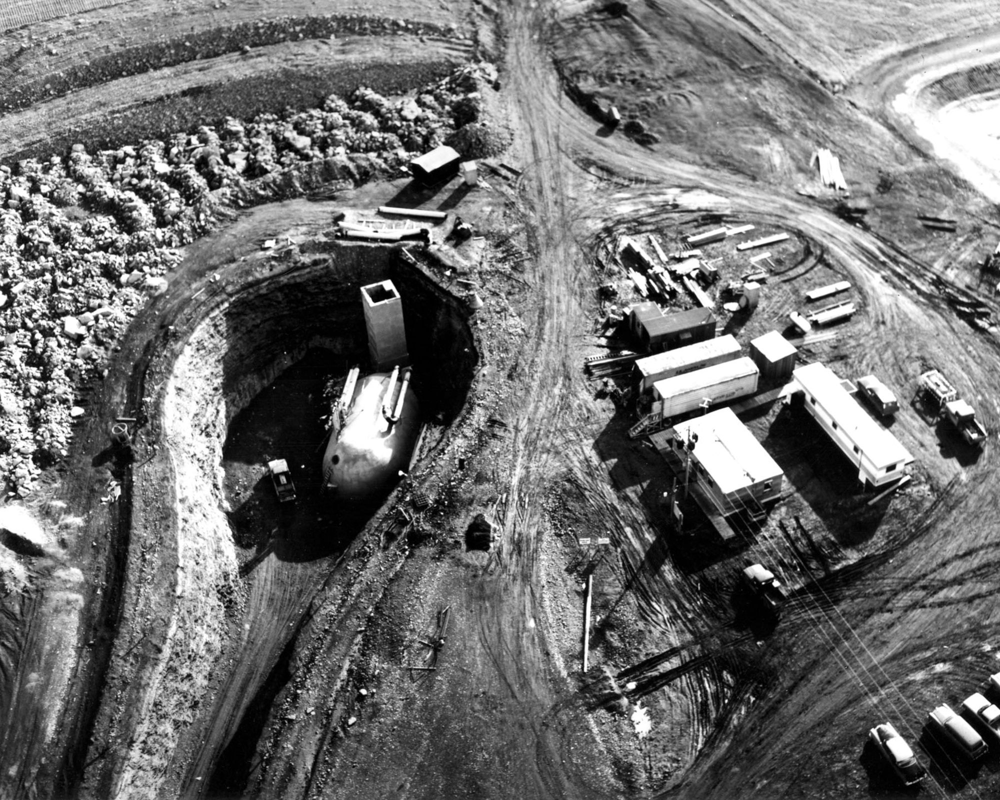 A Launch Control Facility under construction near Malmstrom AFB, Mont. Cold War requirements to build up U.S. nuclear defenses speeded up Minuteman site construction. Builders often labored year-round in three shifts, seven days a week. The Army Corps of Engineers Ballistic Missile Construction Office and its contractors built 1,000 silos between 1961 and 1966. (U.S. Air Force photo)